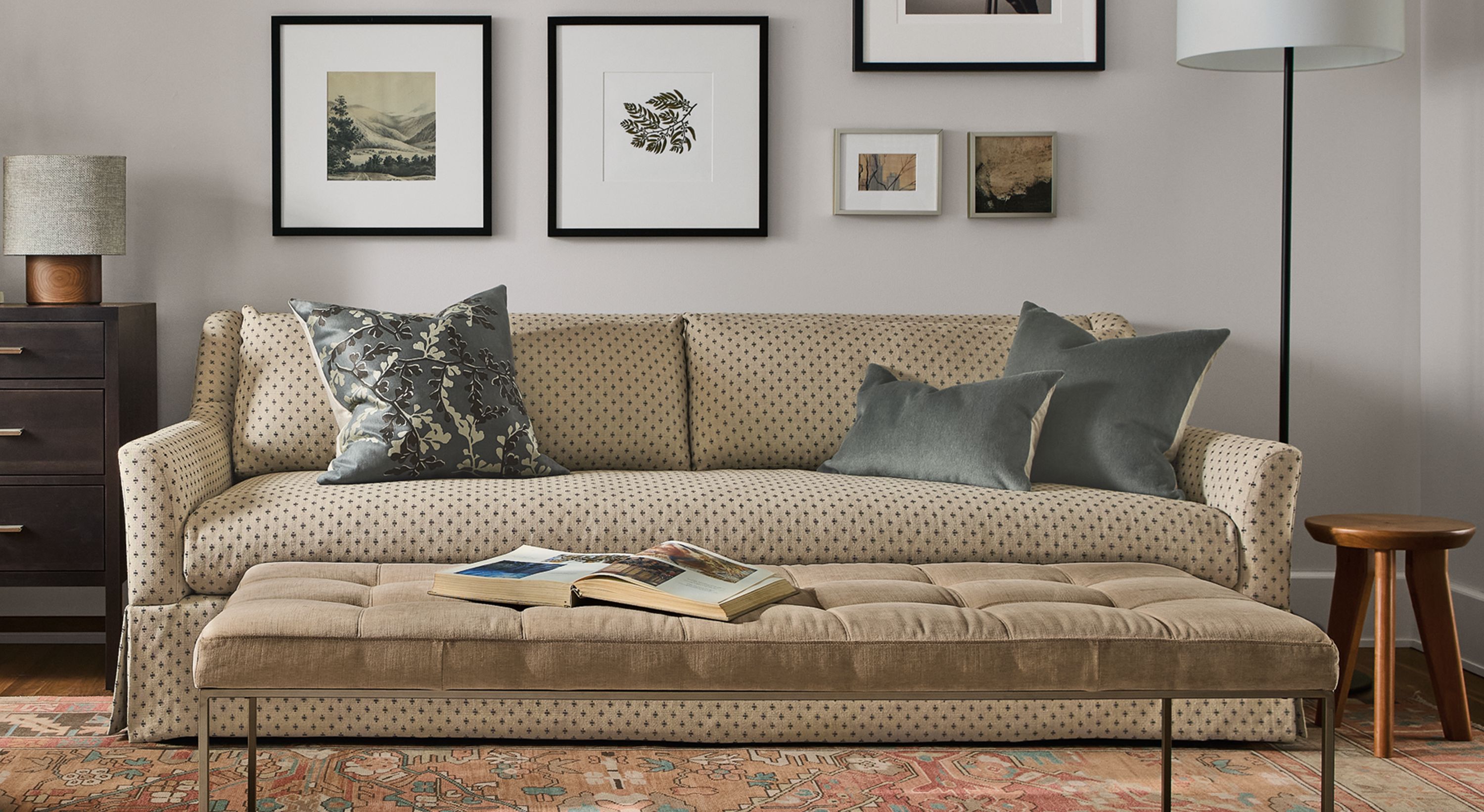 Living room with Sybil skirted sofa in Lockwood Natural, Bram chair in Vento Camel and Tyne bench in Windsor Otter.
