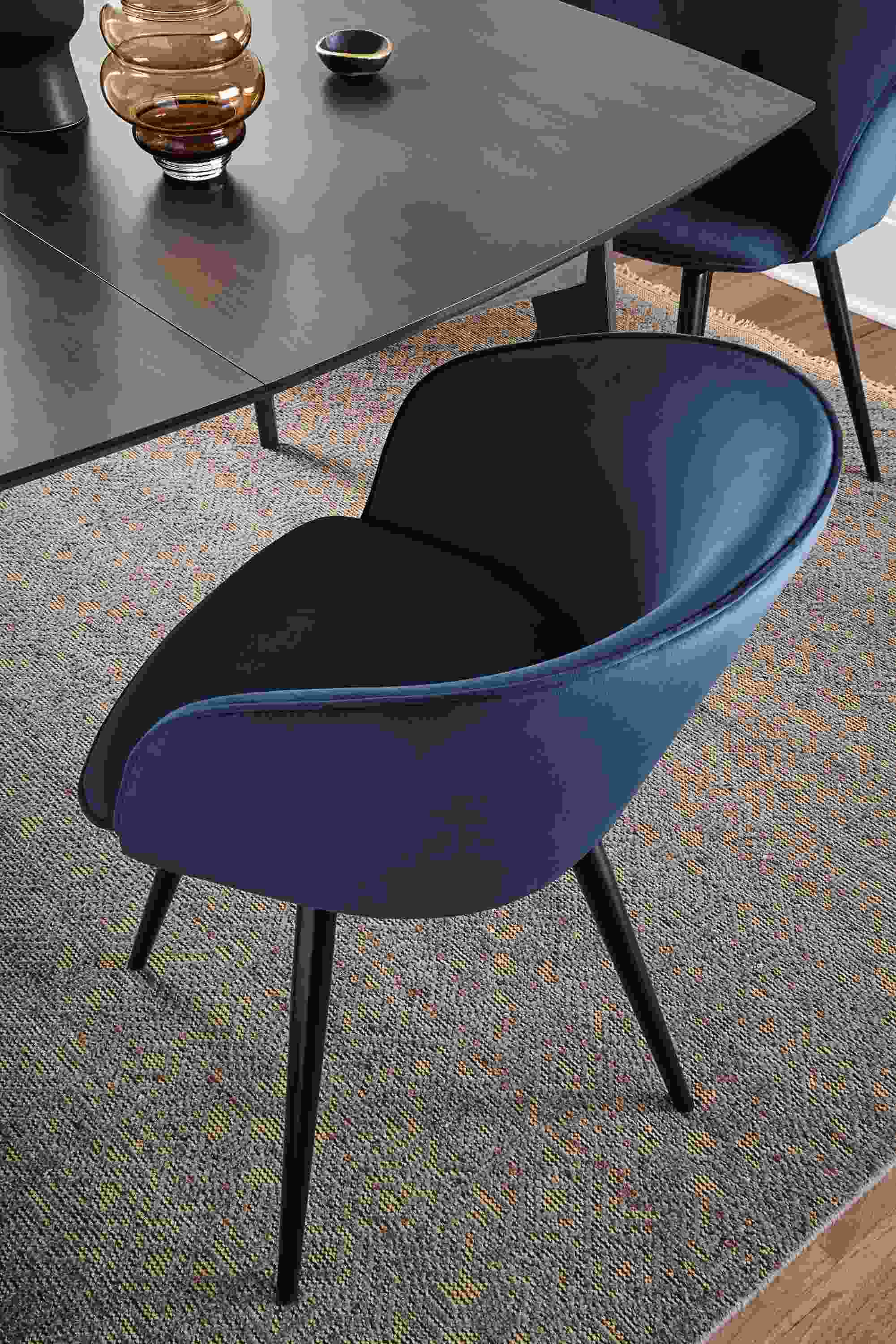 room setting including sylvan swivel side chairs, ventura extension table and anu rug.