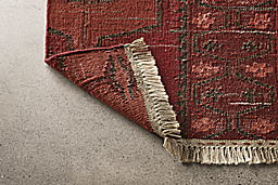 Detail of Tamsa 2x3 rug in rust.