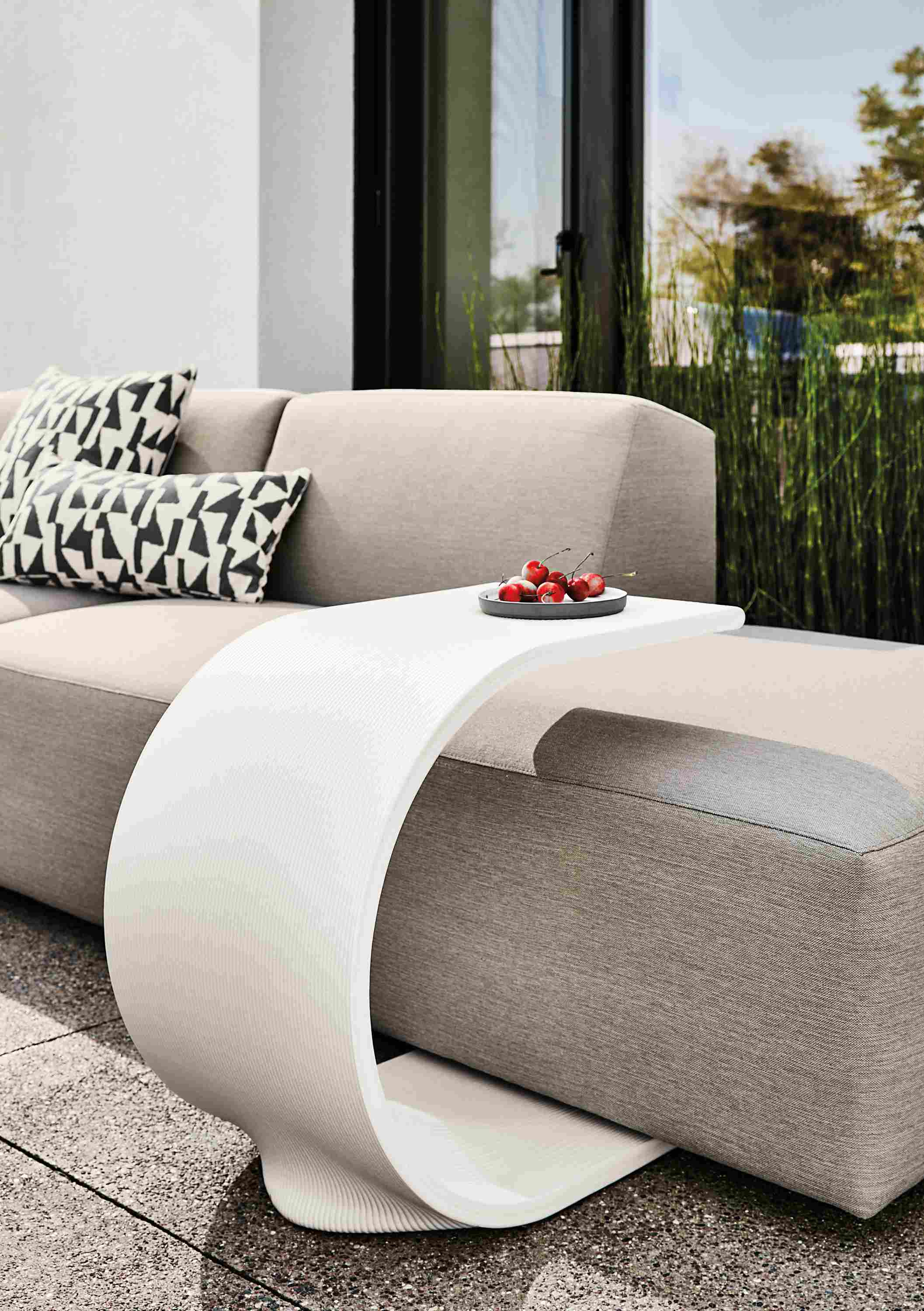 Tangent outdoor c-table in white with Drift sectional in Pelham Cement fabric.