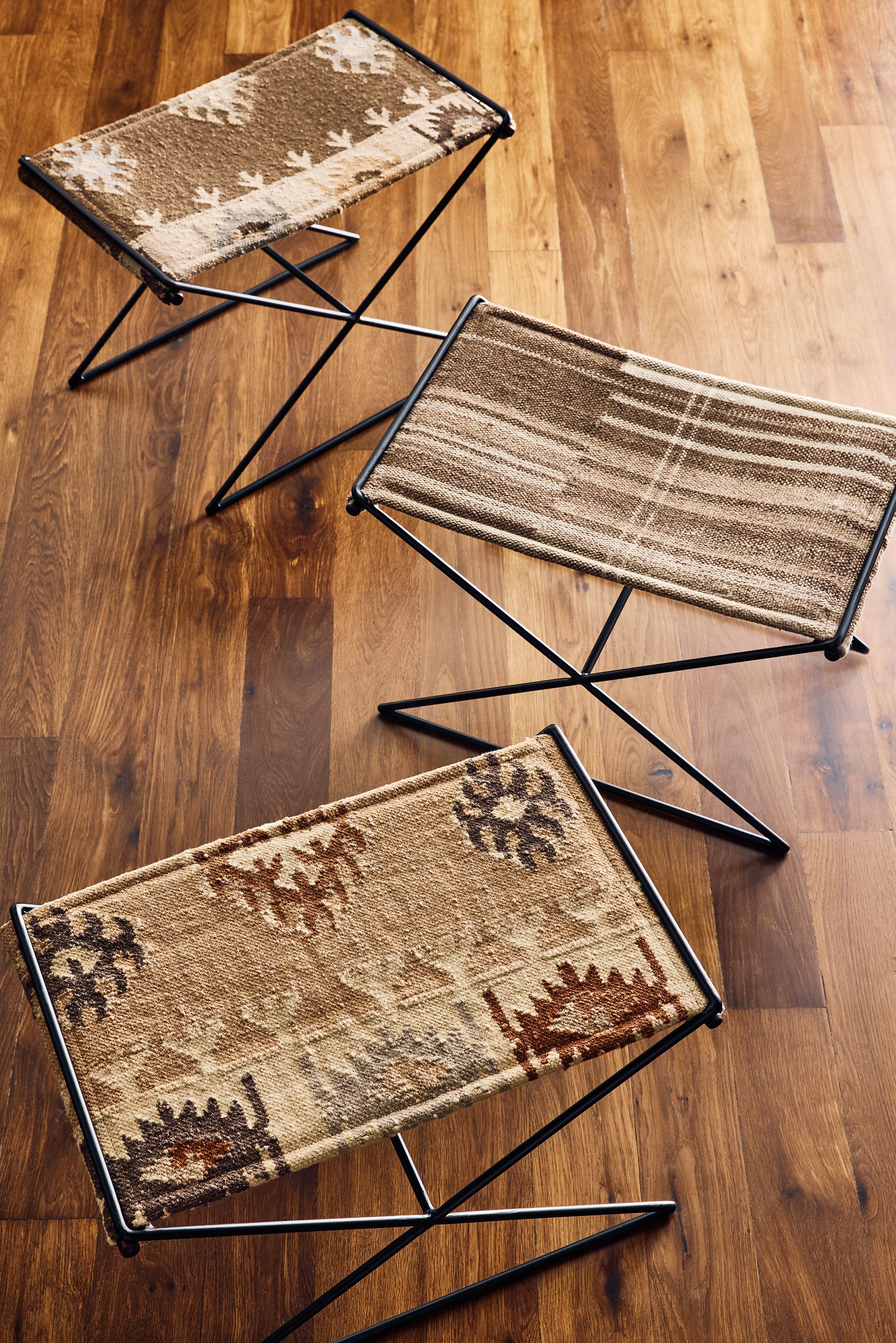 Overhead view of a group of Tavi 25 by 16 stools in Izel Sienna, Serra Earth and Izel Earth.