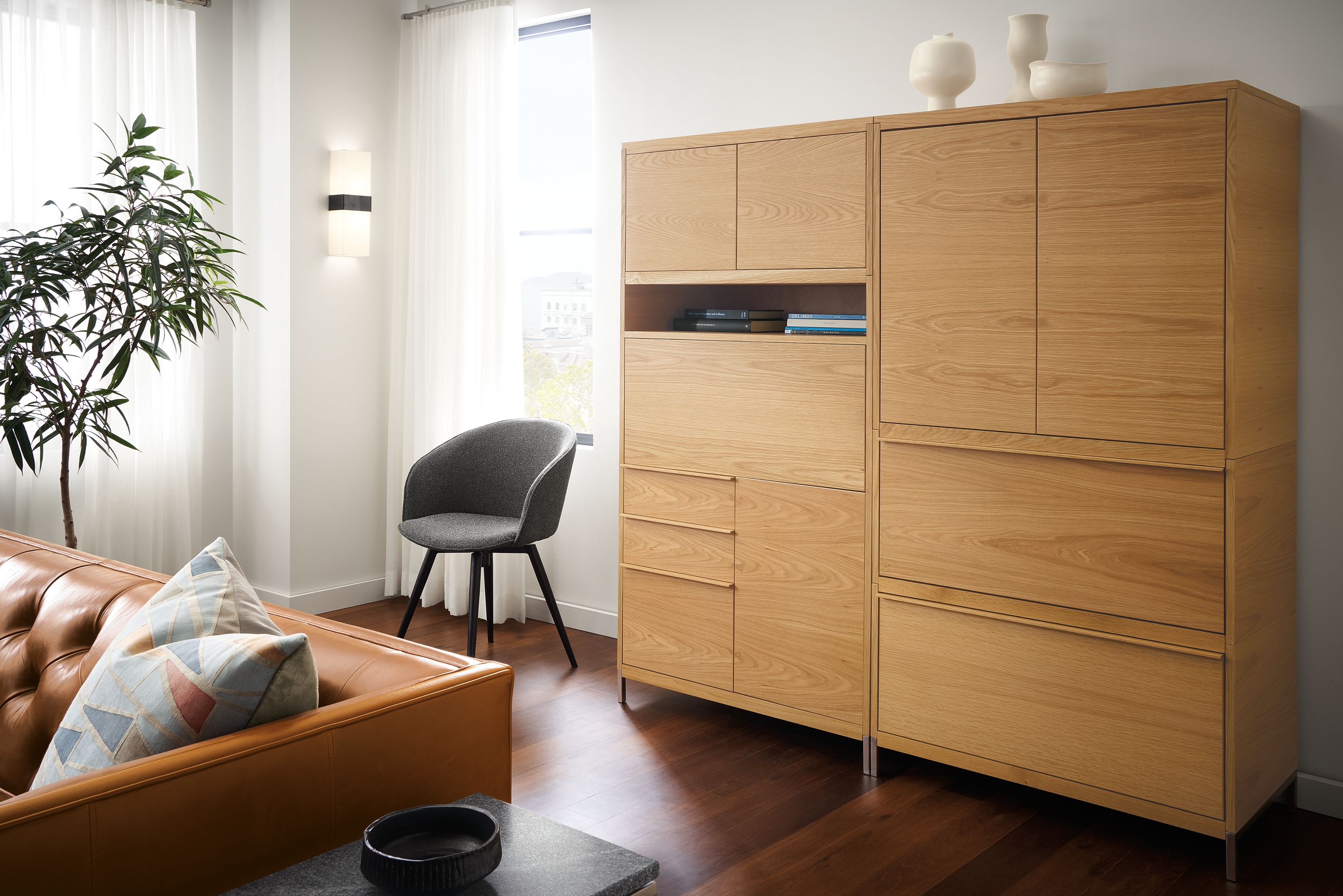 detail of tayor office wall unit piece in white oak with drop-down desk upright.