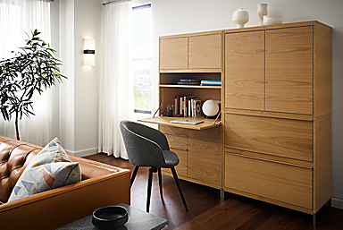 detail of tayor office wall unit piece in white oak with drop-down desk extended.