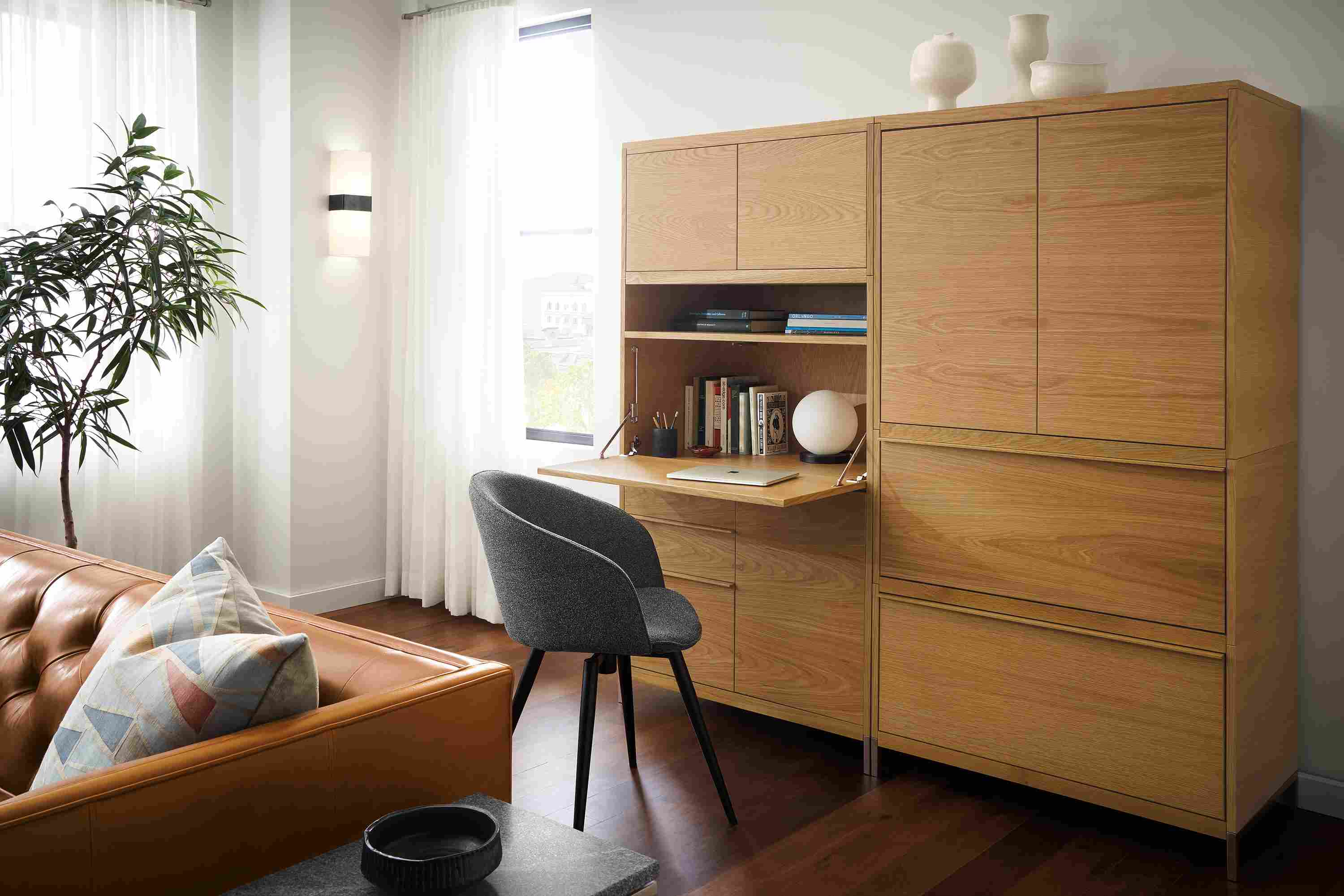 Detail of Taylor office wall unit in white oak with drop-down desk extended.