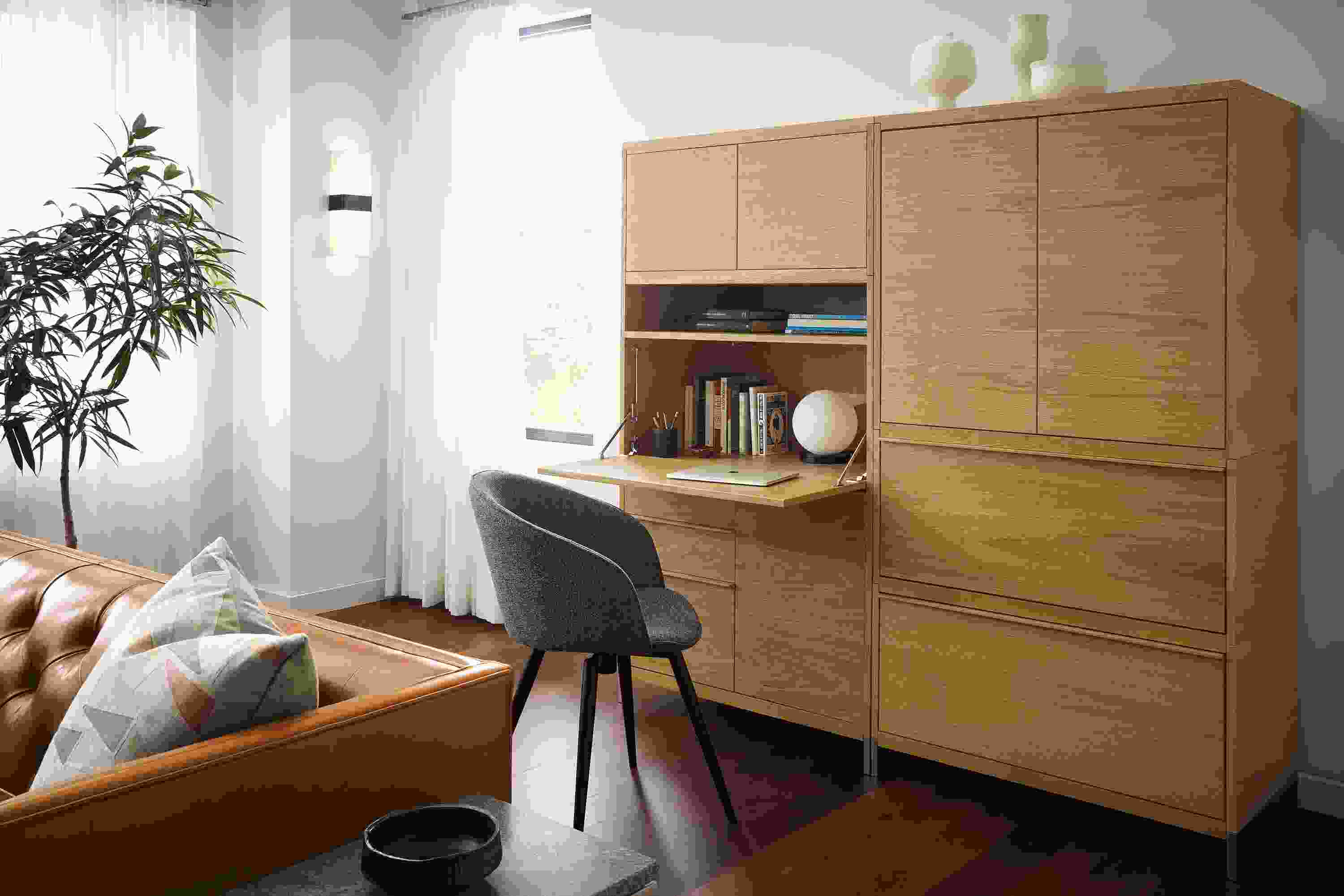 Detail of Taylor office wall unit in white oak with drop-down desk extended.