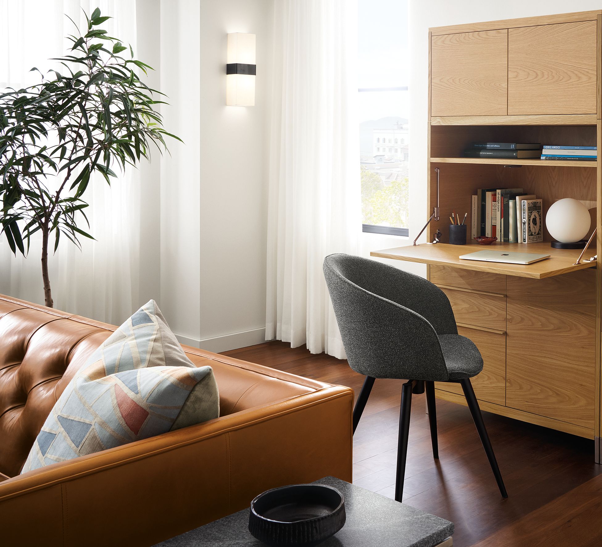 detail of taylor office wall unit piece in white oak with drop-down desk extended.