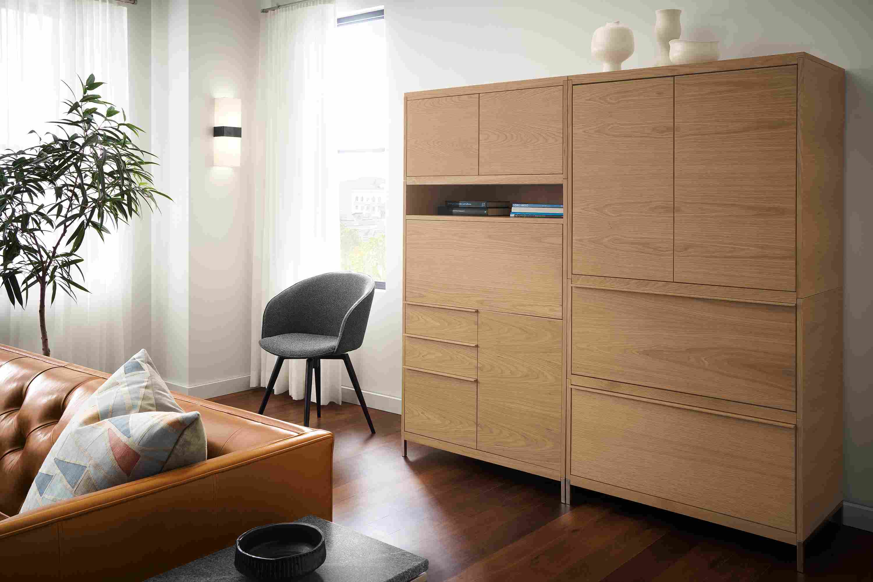 Detail of Taylor office wall unit in Rye on red oak with drop-down desk closed.