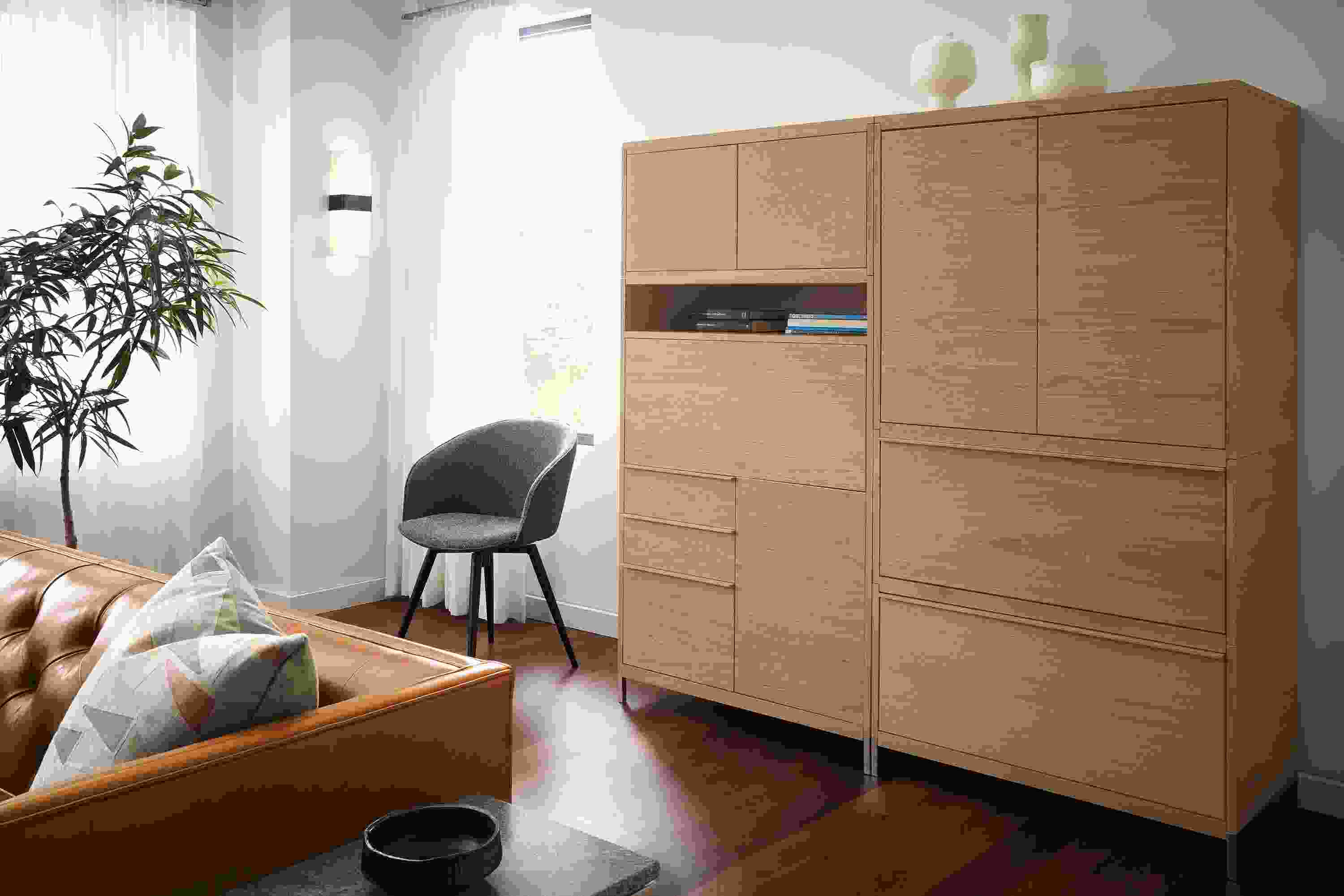Detail of Taylor office wall unit in Rye on red oak with drop-down desk closed.
