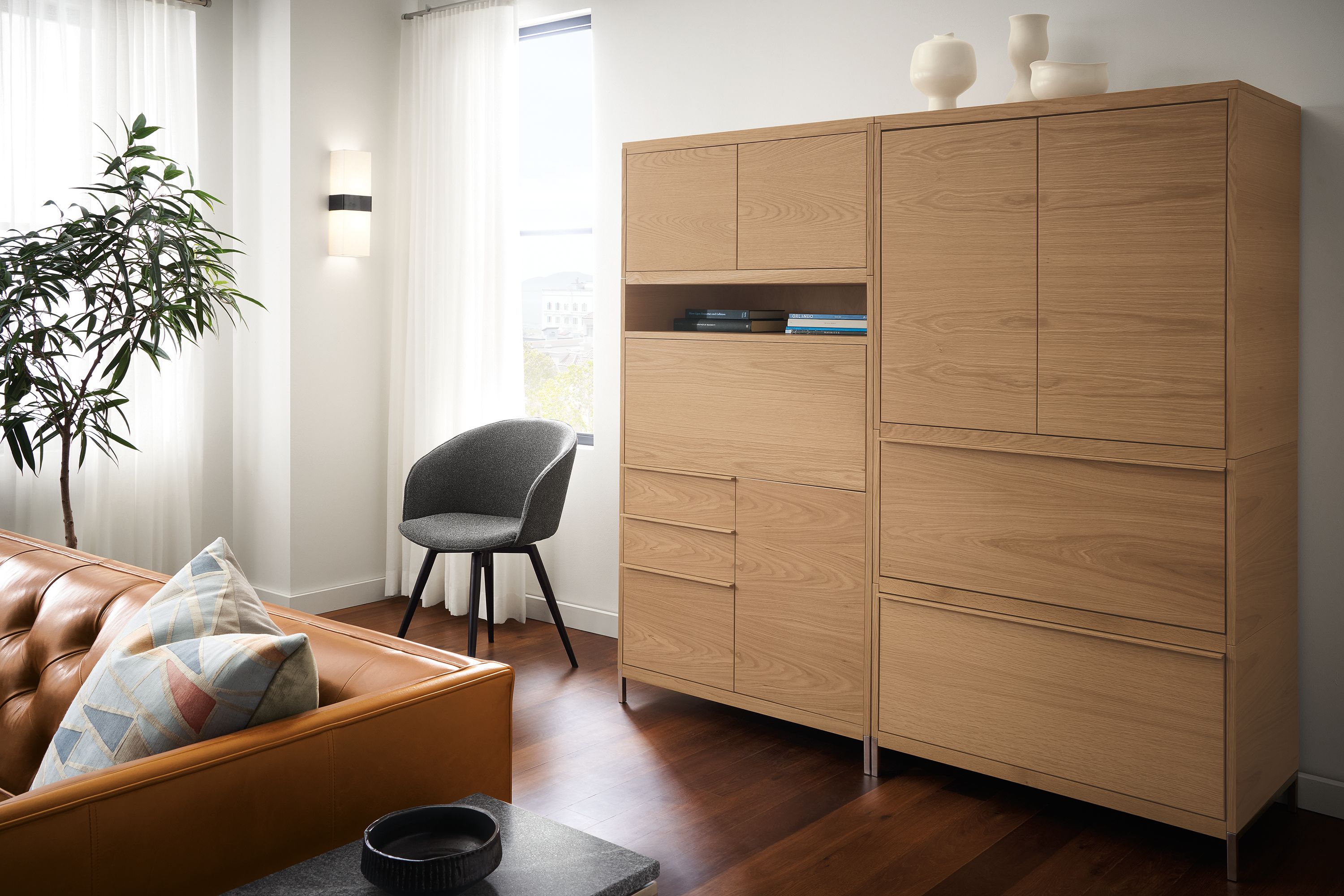 Detail of Taylor office wall unit in Rye on red oak with drop-down desk closed.