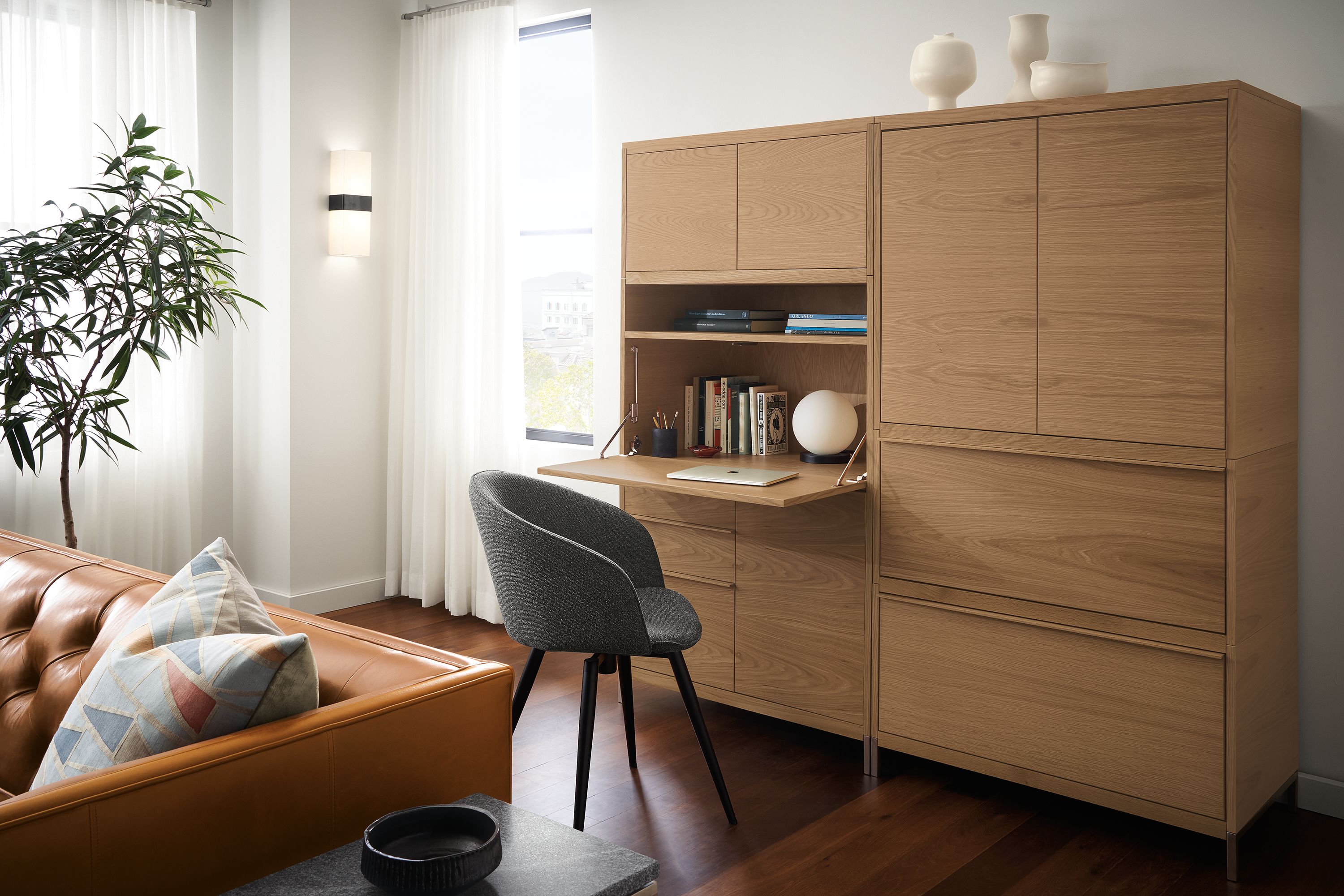 Detail of Taylor office wall unit in Rye on red oak with drop-down desk extended.