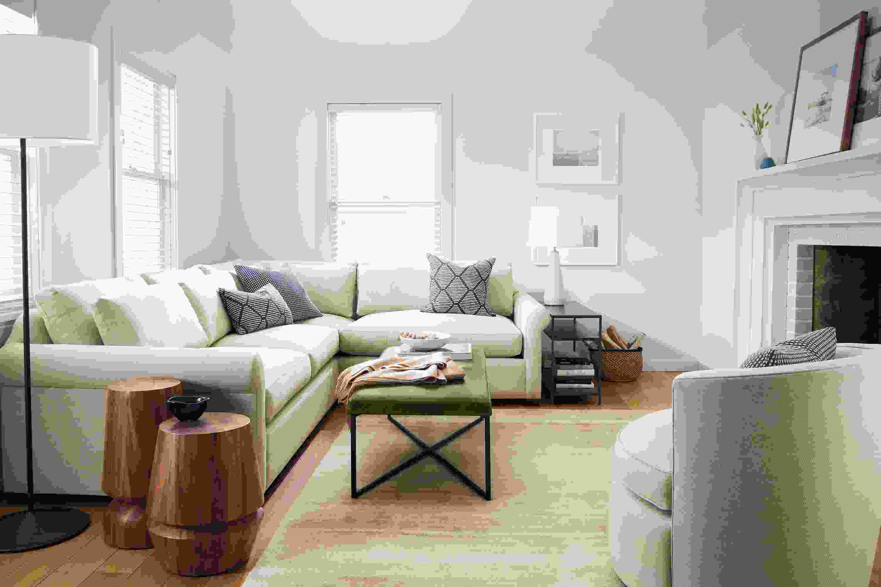 living room with tegan sectional in gino oatmeal with sidney ottoman and otis chair.