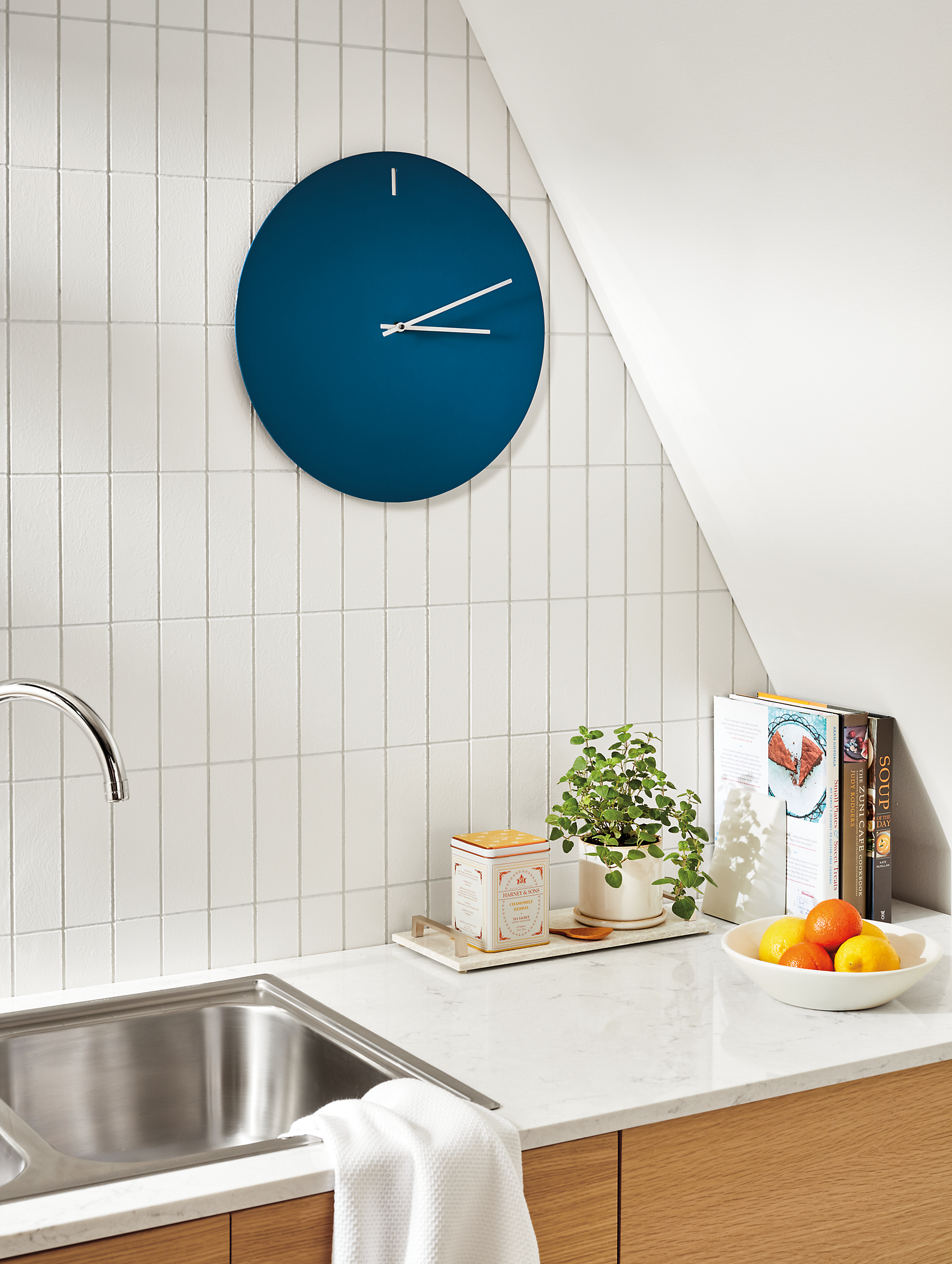 small kitchen area with tempo wall clock in sapphire