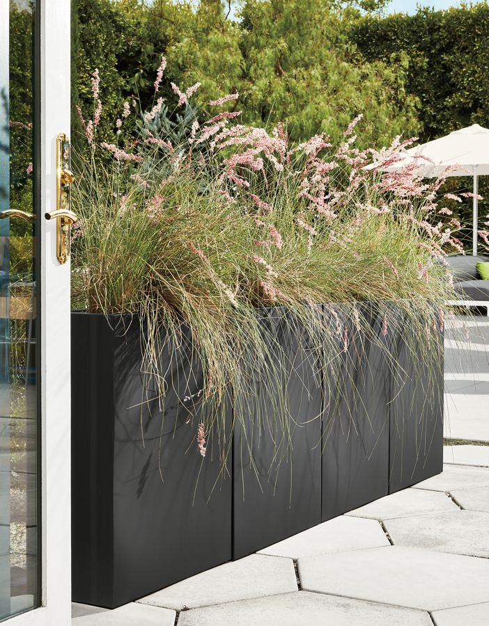 Detail of 4 Terrace rectangle planters in graphite in outdoor space.