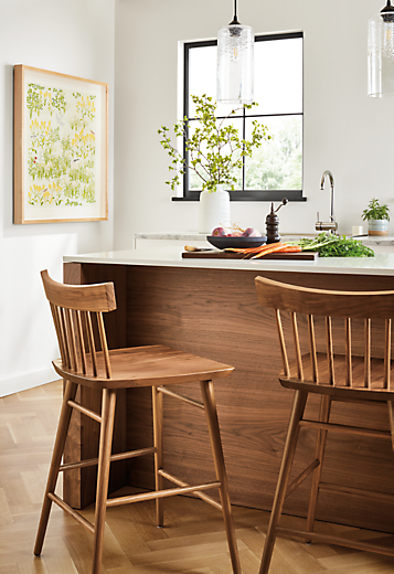 two thatcher counter stools in walnut at amherst kitchen island.