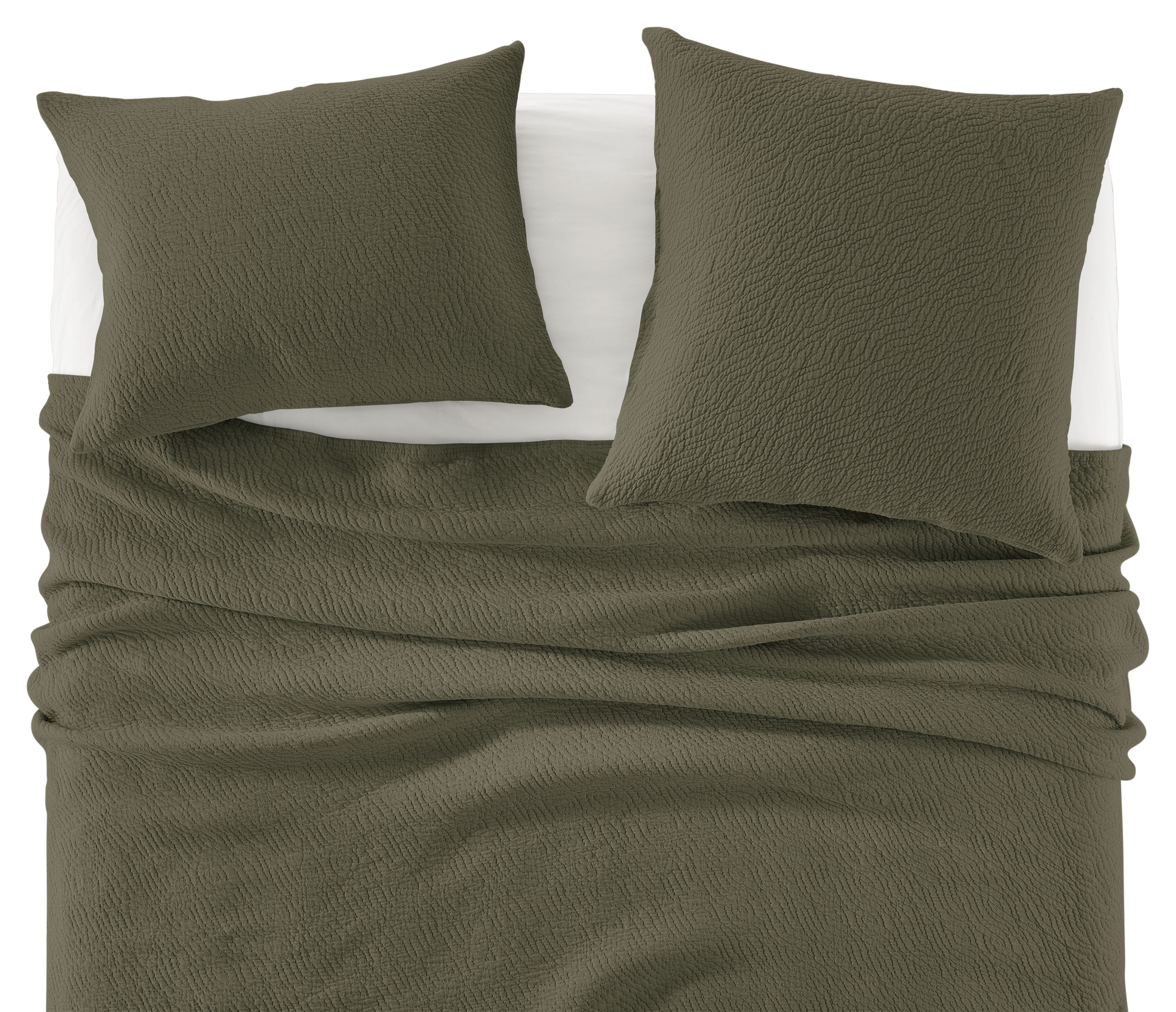 Detail of Thea Matelasse Full-Queen Coverlet and shams in Spruce with White percale sheets.