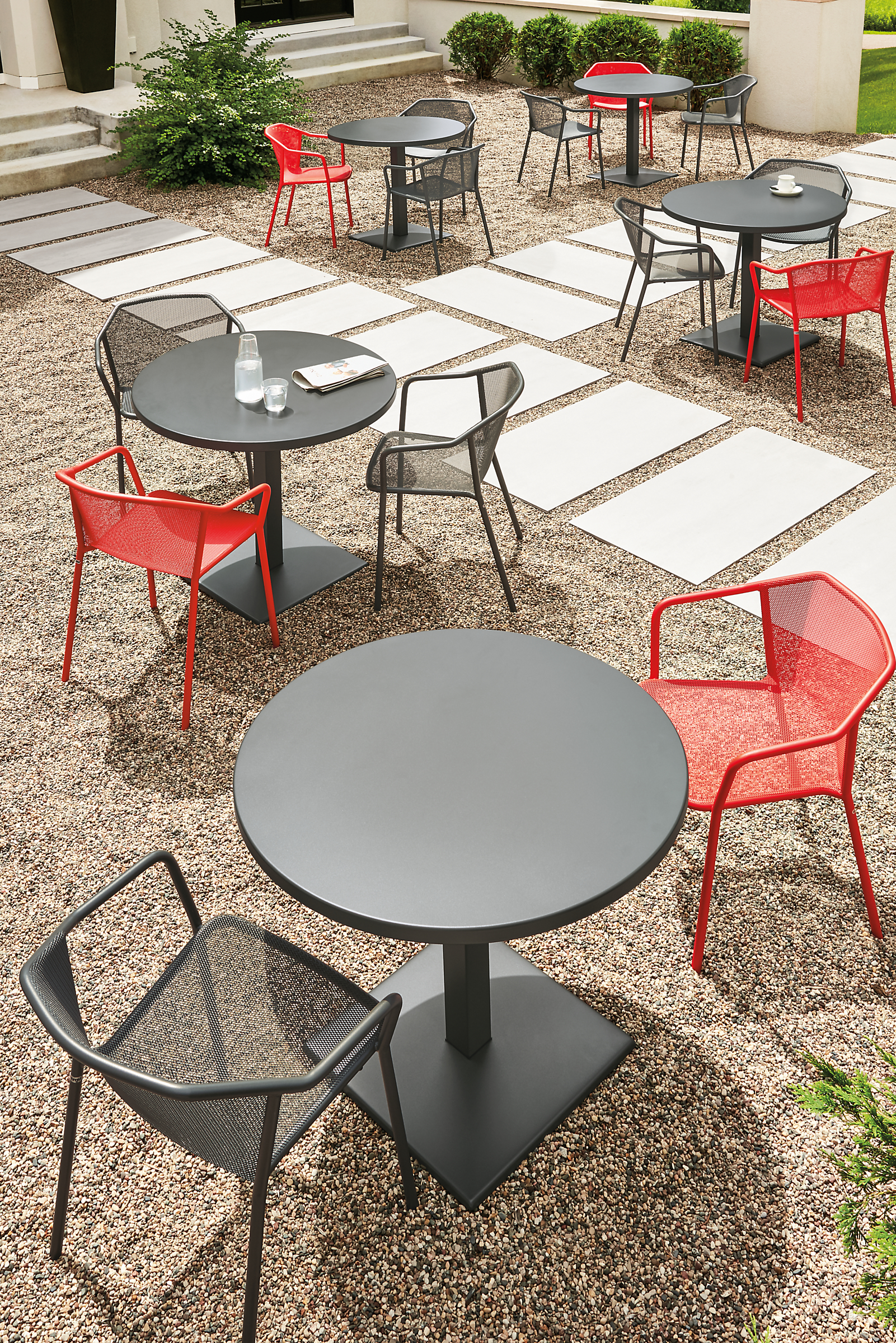 Detail of Theo chairs and Maris round tables on patio.
