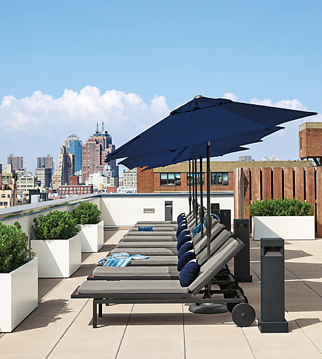 Outdoor entertaining furniture on rooftop.