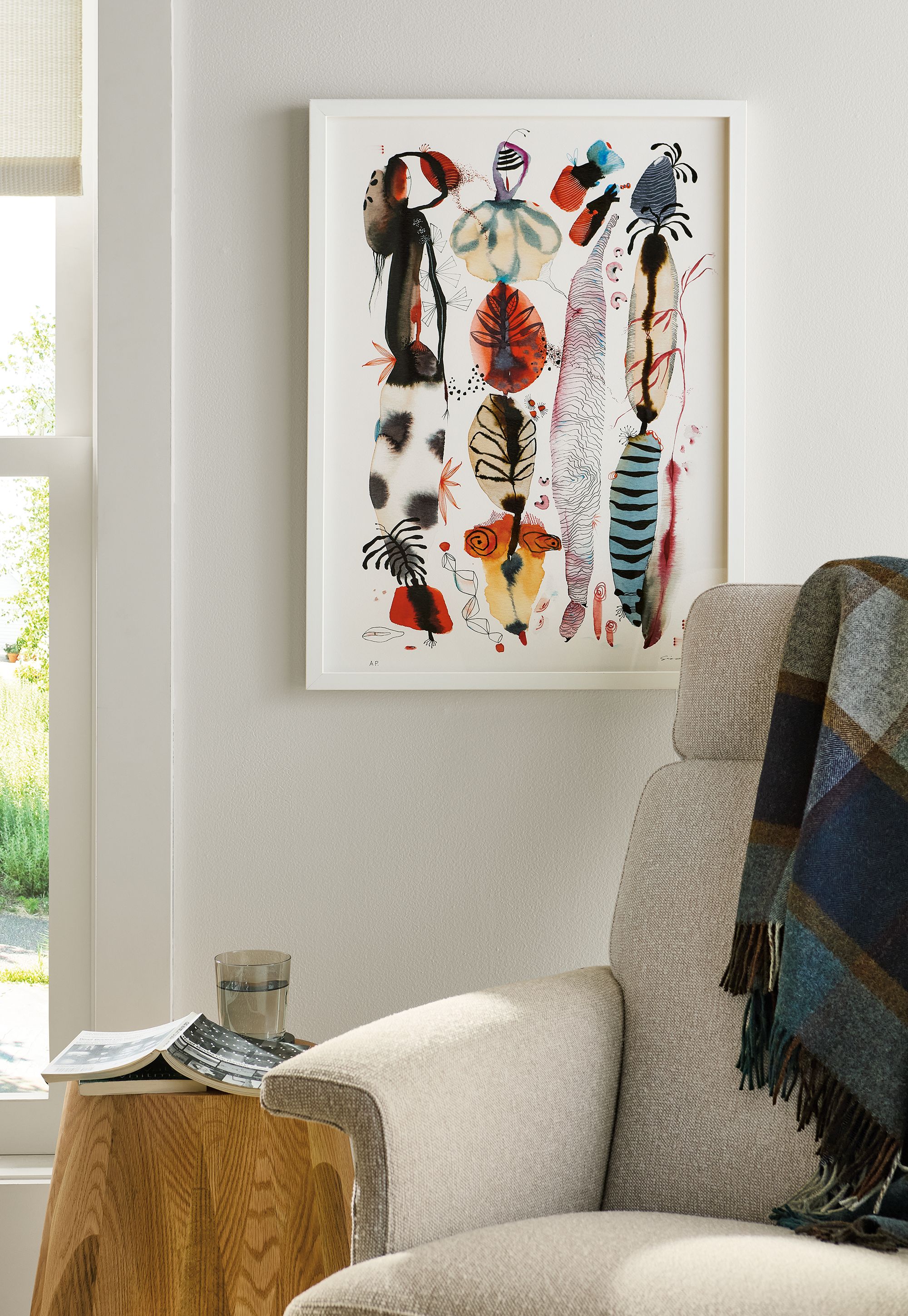 Living room with detail of suyao tian artwork reverie reverberations #2, and daniel swivel chair in conley natural.