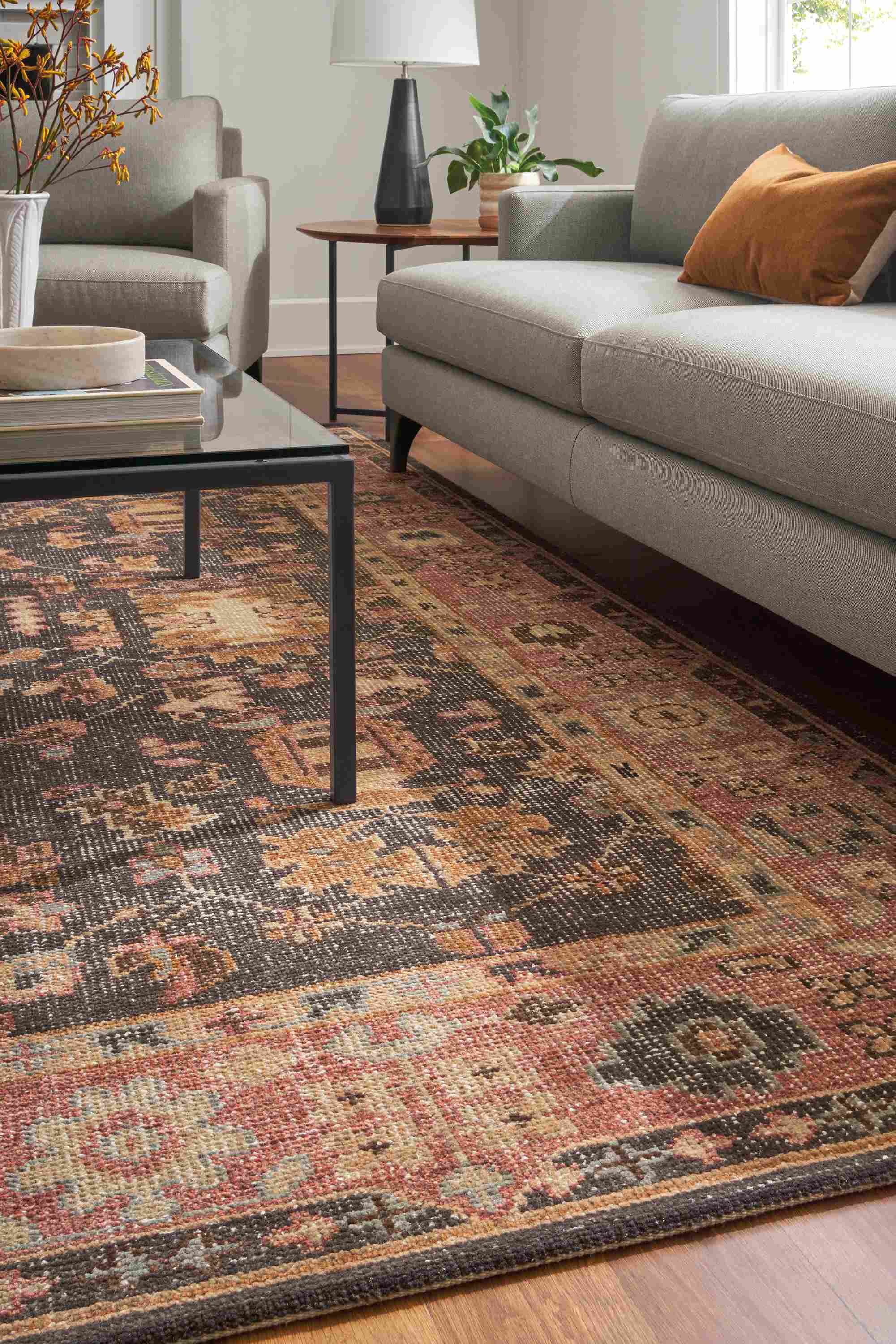 living room with tillia rug, parsons coffee table, carlton sofa.