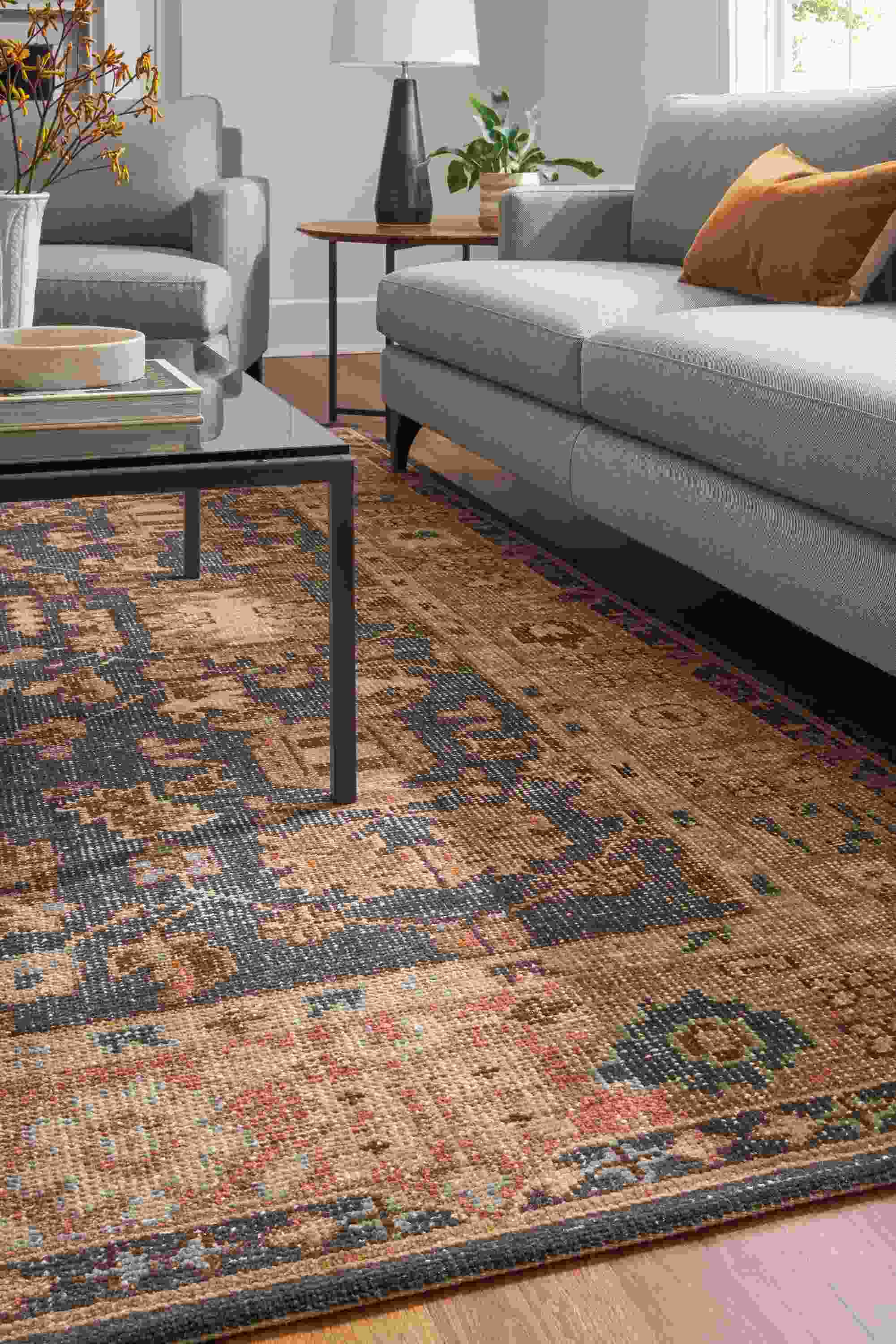 living room with tillia rug, parsons coffee table, carlton sofa.