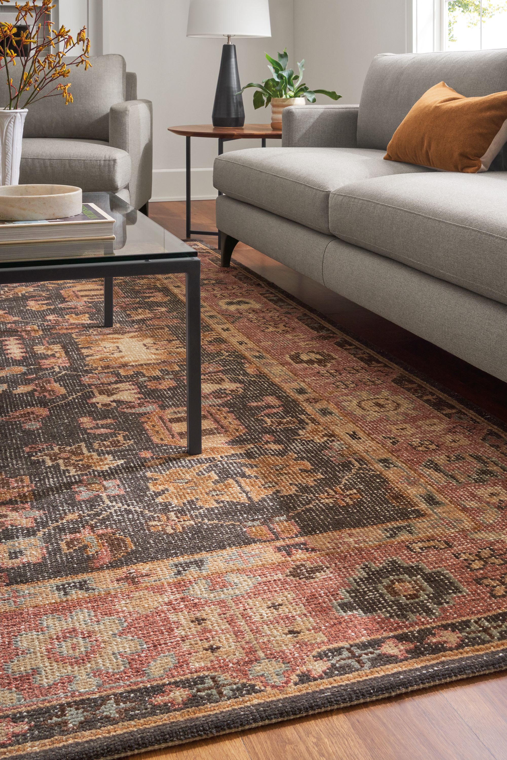 living room with tillia rug, parsons coffee table, carlton sofa.