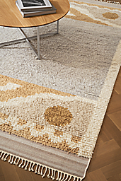 detail of tova rug and classic coffee table in stainless steel.
