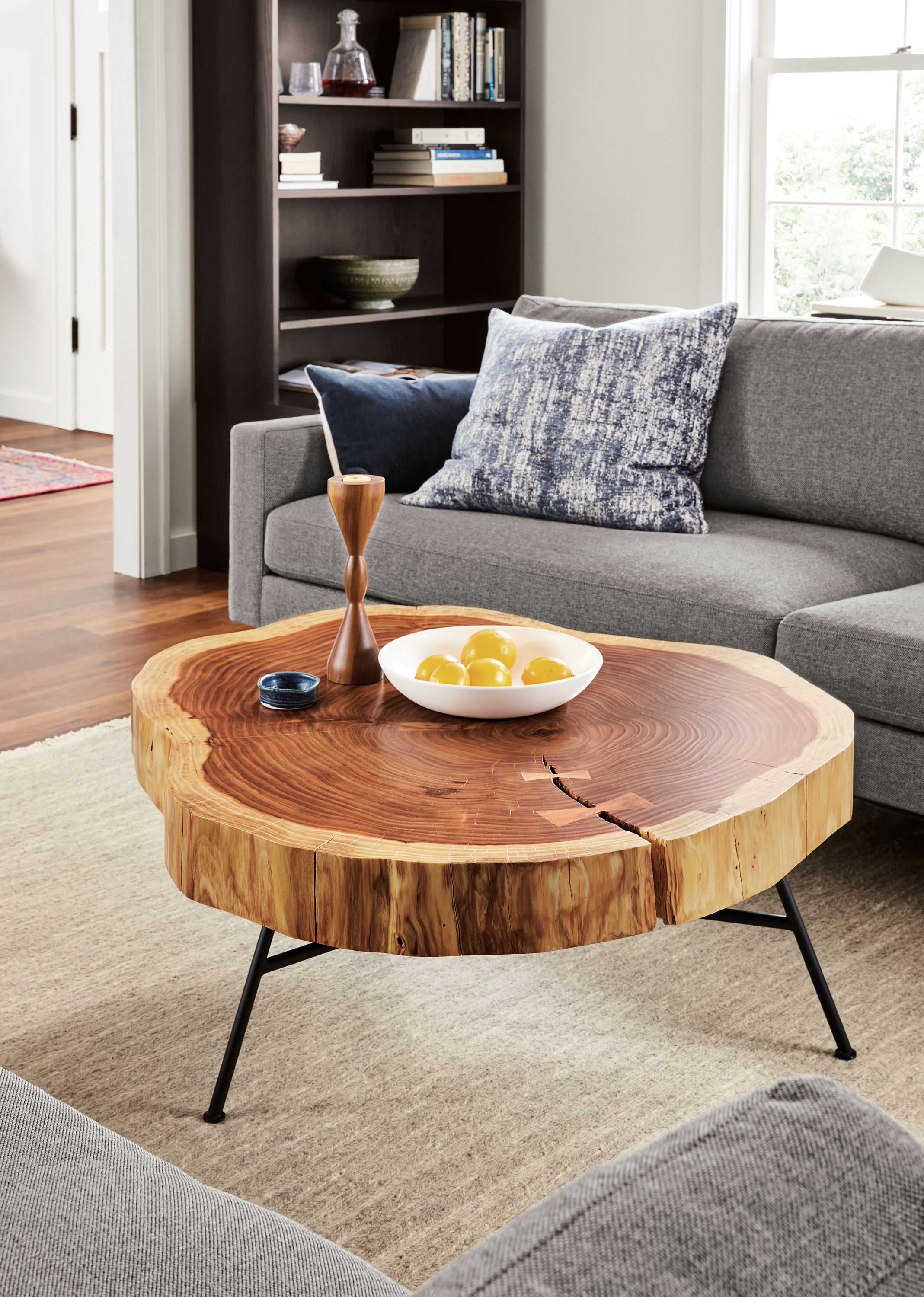 room setting including truxel table, pierson sofa, keaton bookcase.