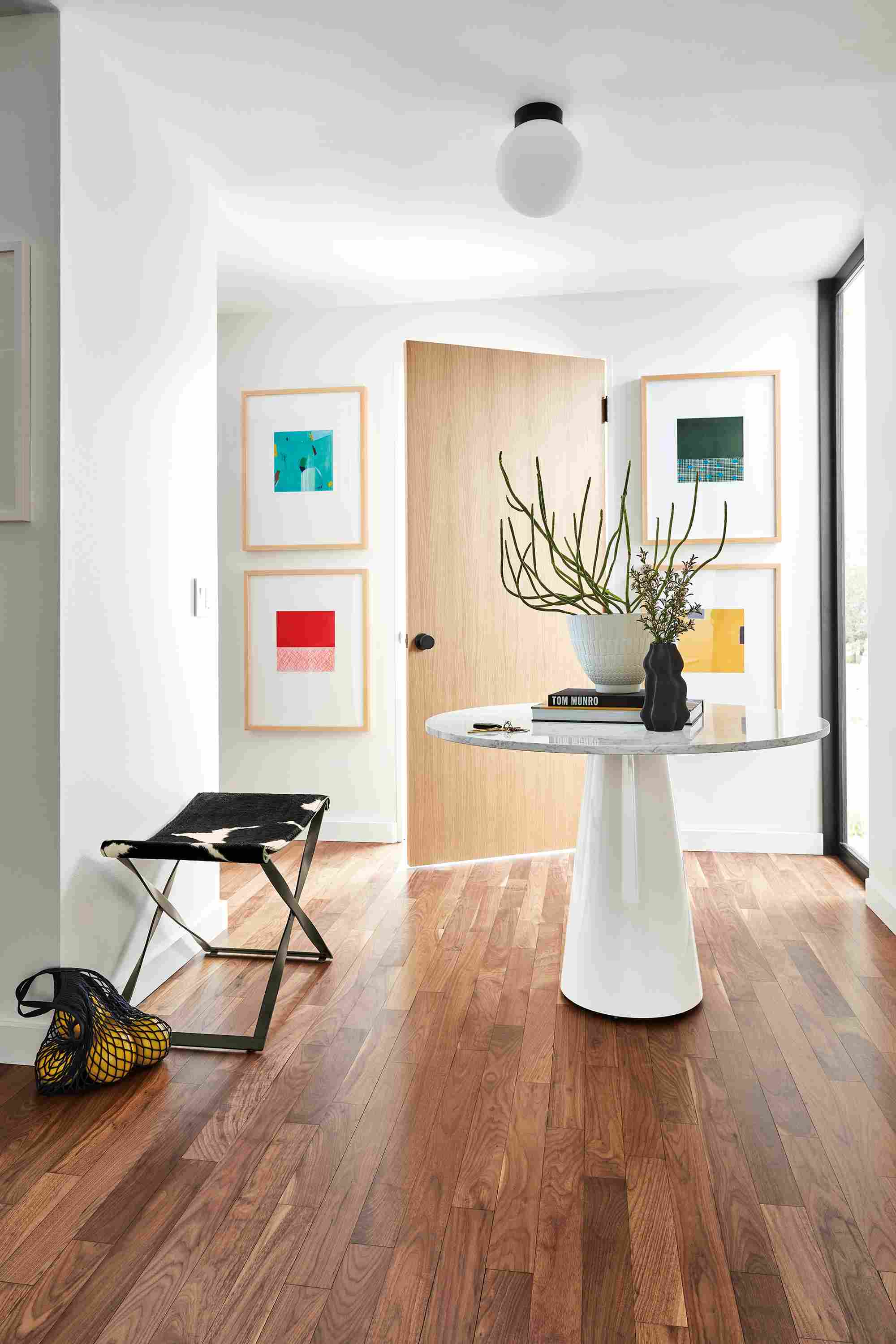 Detail of Vuni Van Dyke prints, Decker table, Karr stool and orbit sconce.