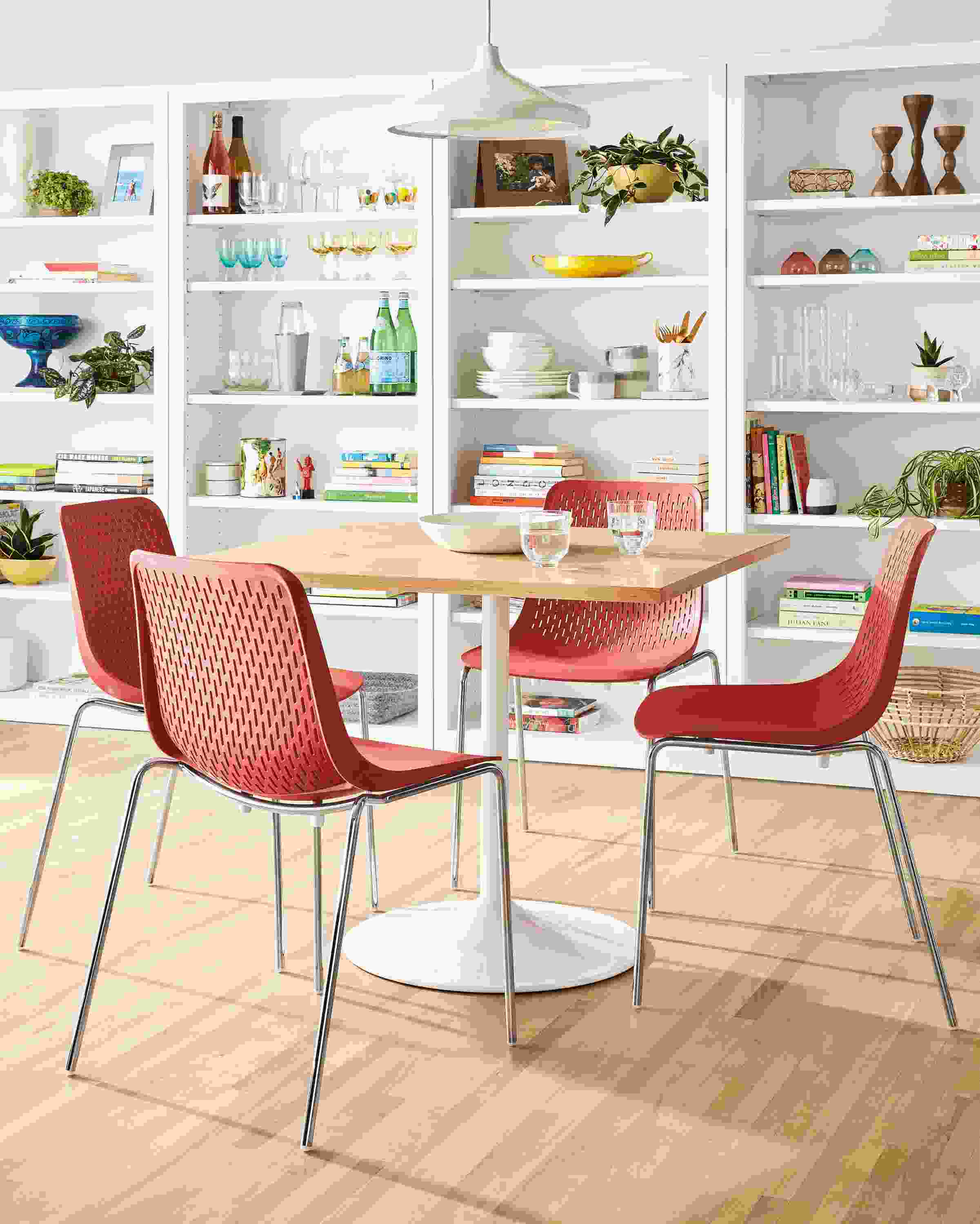 Detail of 4 Vasa side chairs in Poppy set at Aria table.