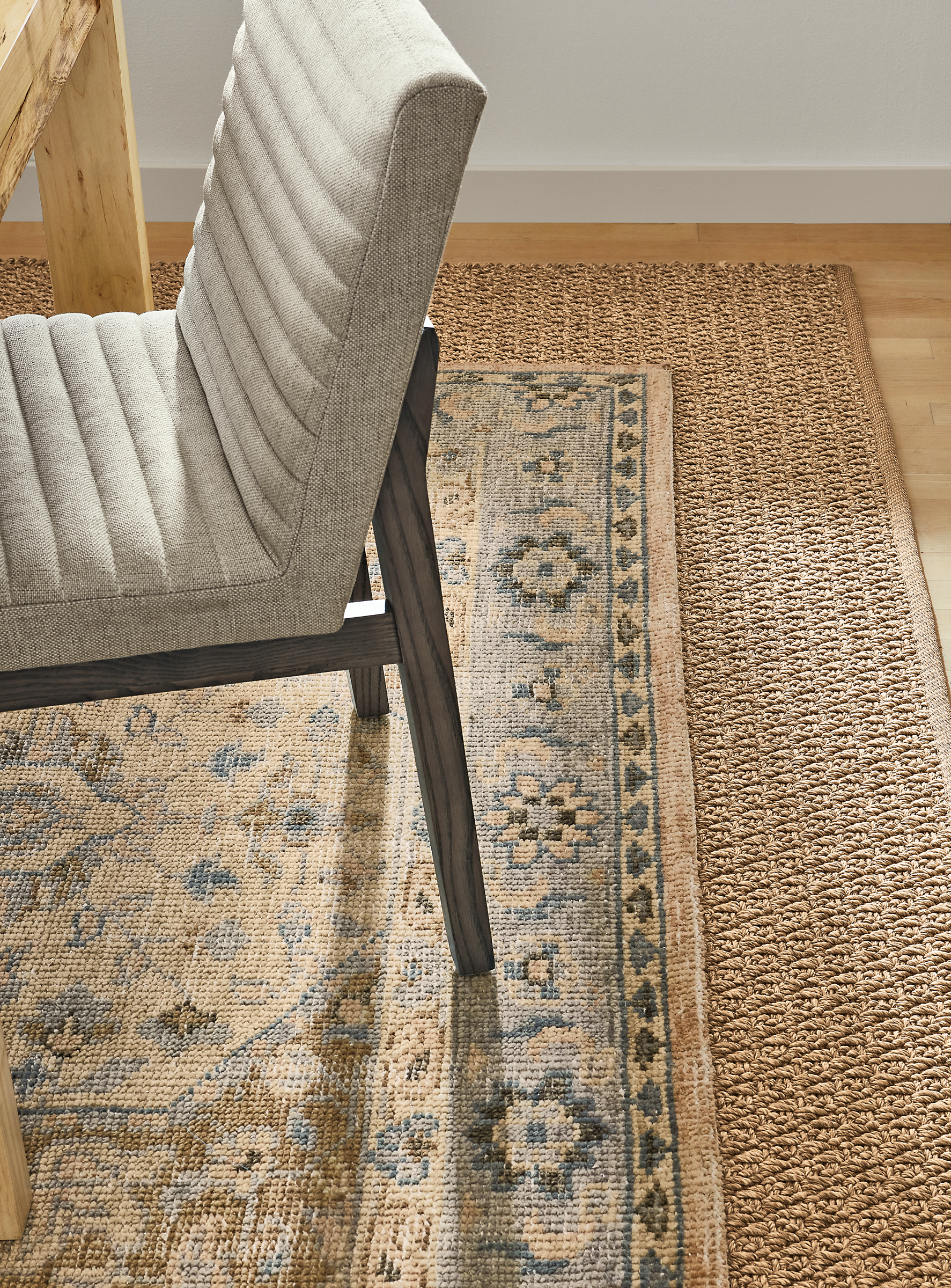 detail of veda rug, essence rug, walsh table, olsen side chair.