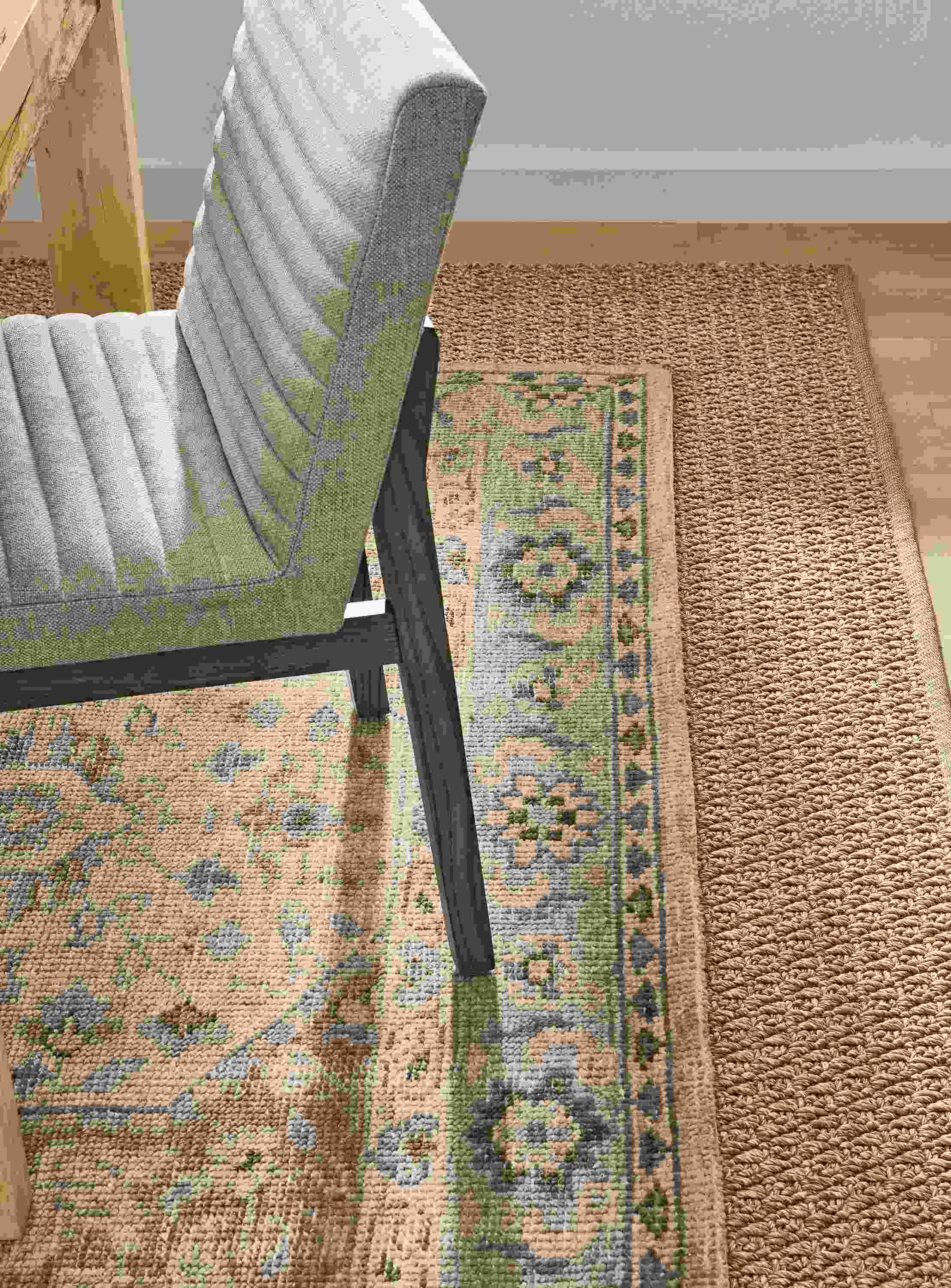 Detail of veda rug, essence rug, walsh table, olsen side chair.