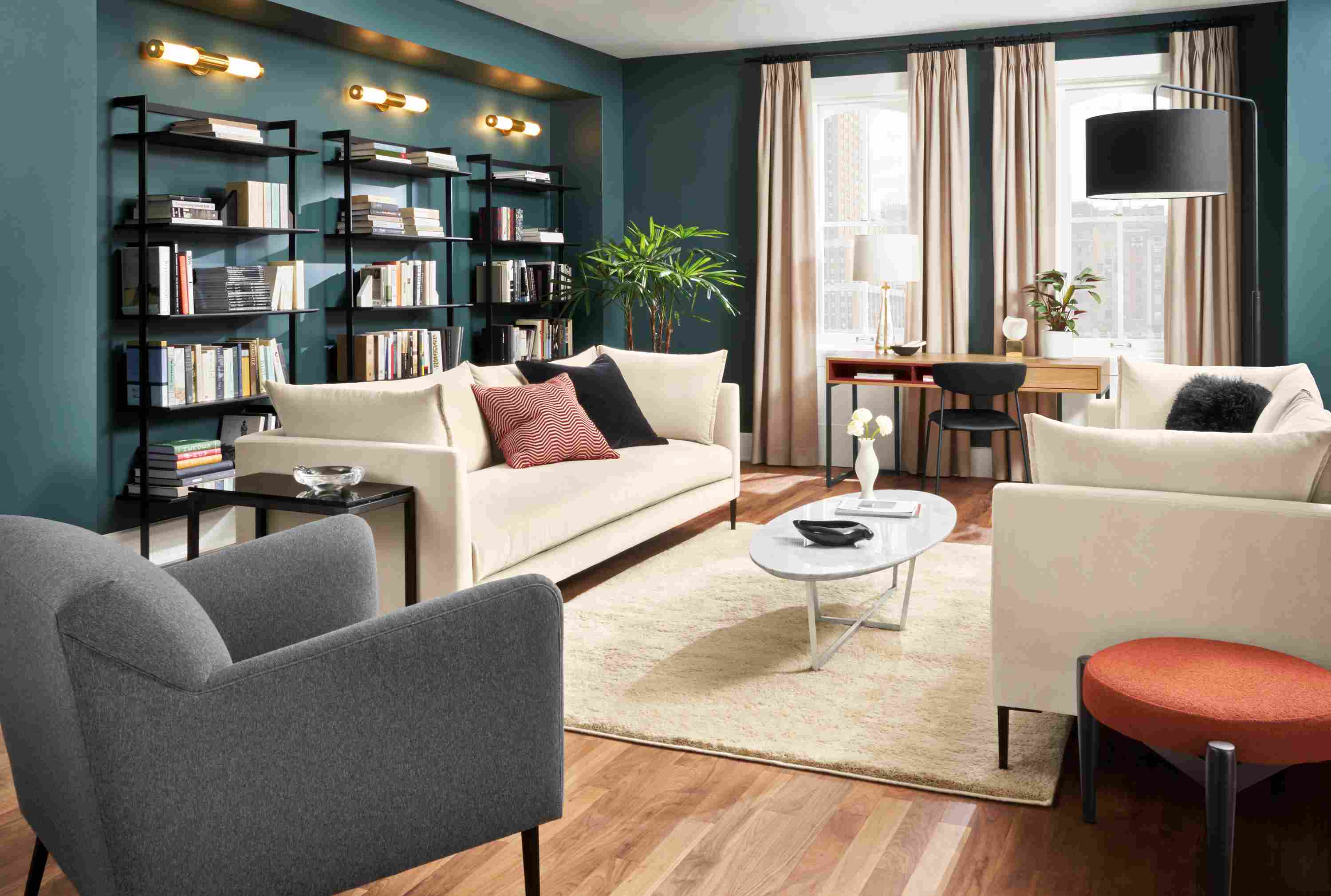 Living room with 2 Vela bench-cushion sofa in banks natural and Matteo chair in Flint Charcoal.