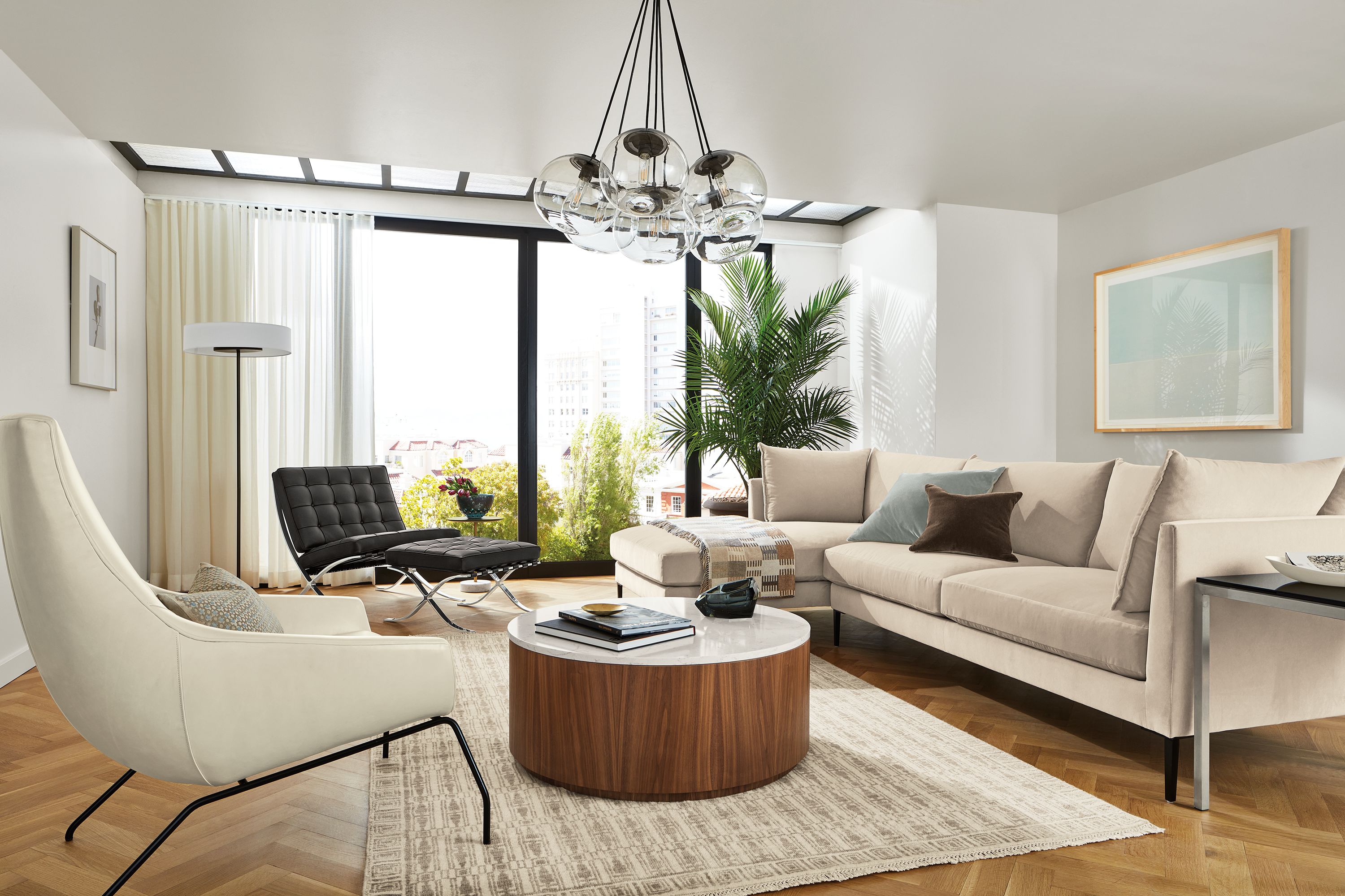 Living room with vela sofa in Banks Natural, seville chair and rhodes lounge chair.