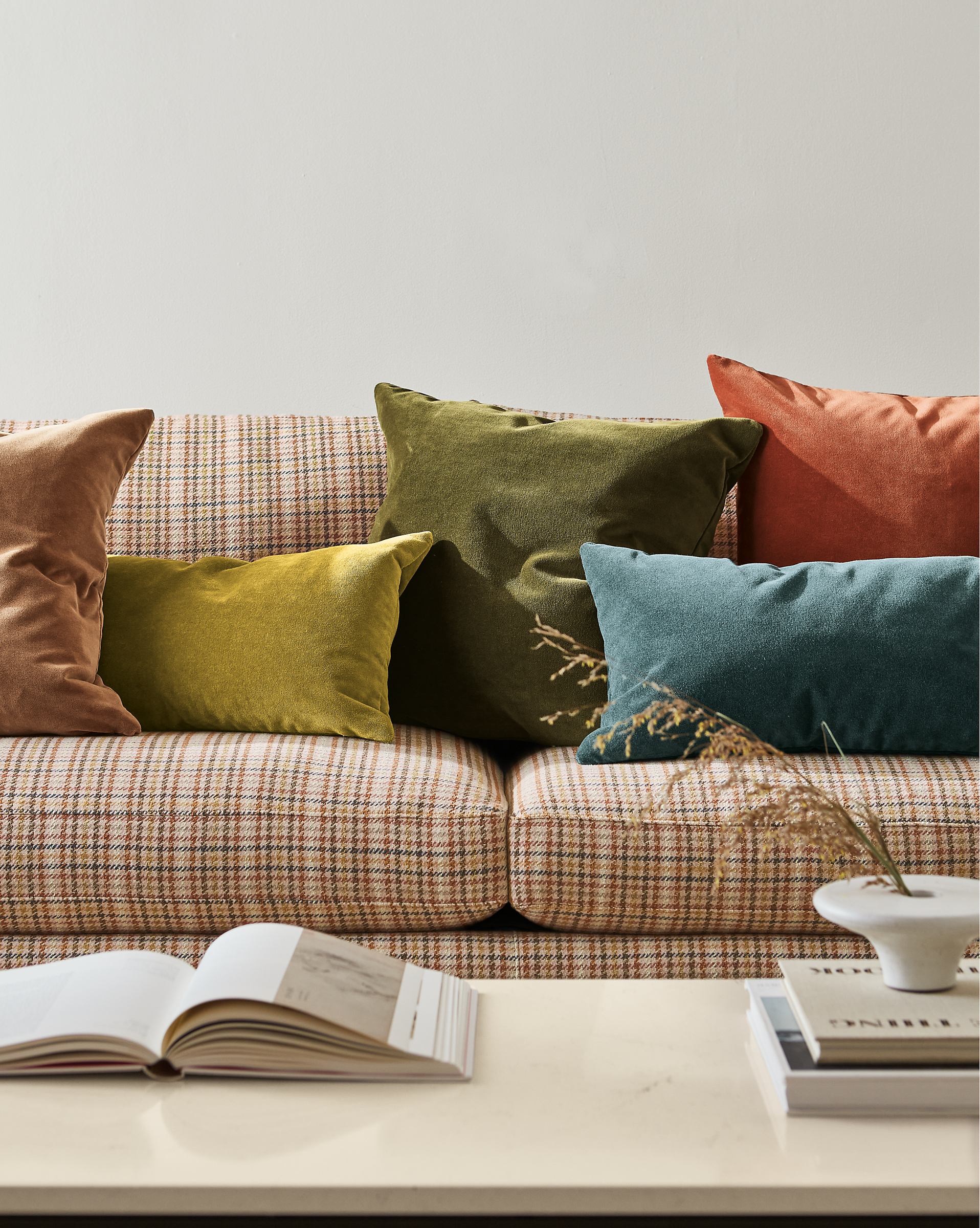 detail of colorful velvet pillows on jasper sofa.
