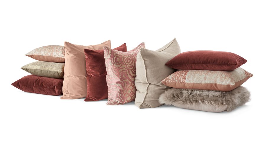Collage of velvet throw pillows.