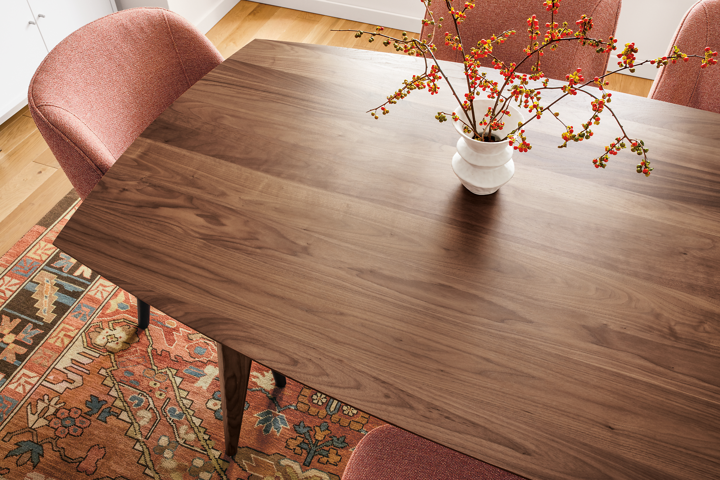 Detail of large Ventura dining table in walnut.