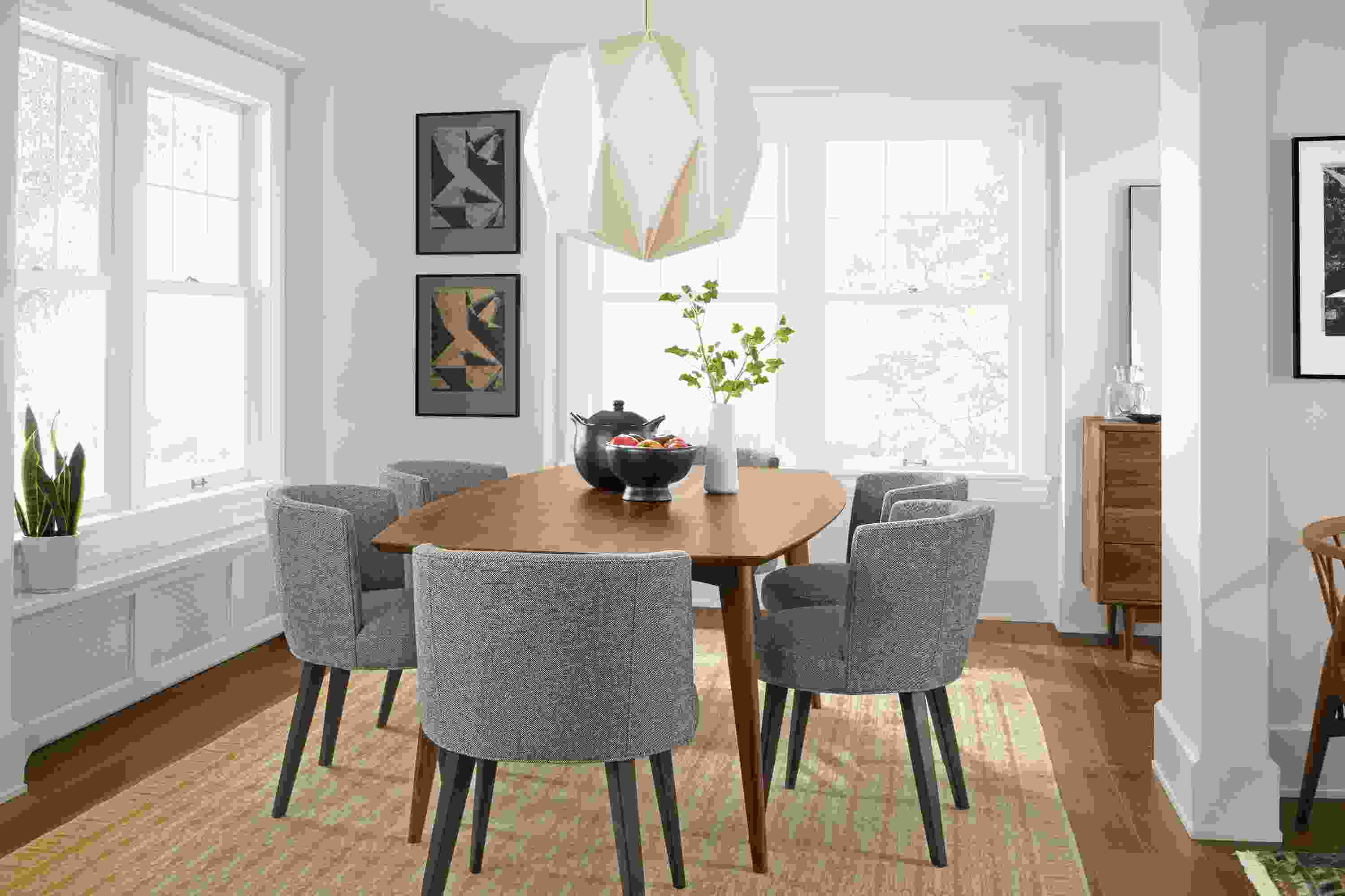 Dining room with Ventura table in walnut, 6 June side chairs in Tatum Spruce and Tulum rug in wheat.
