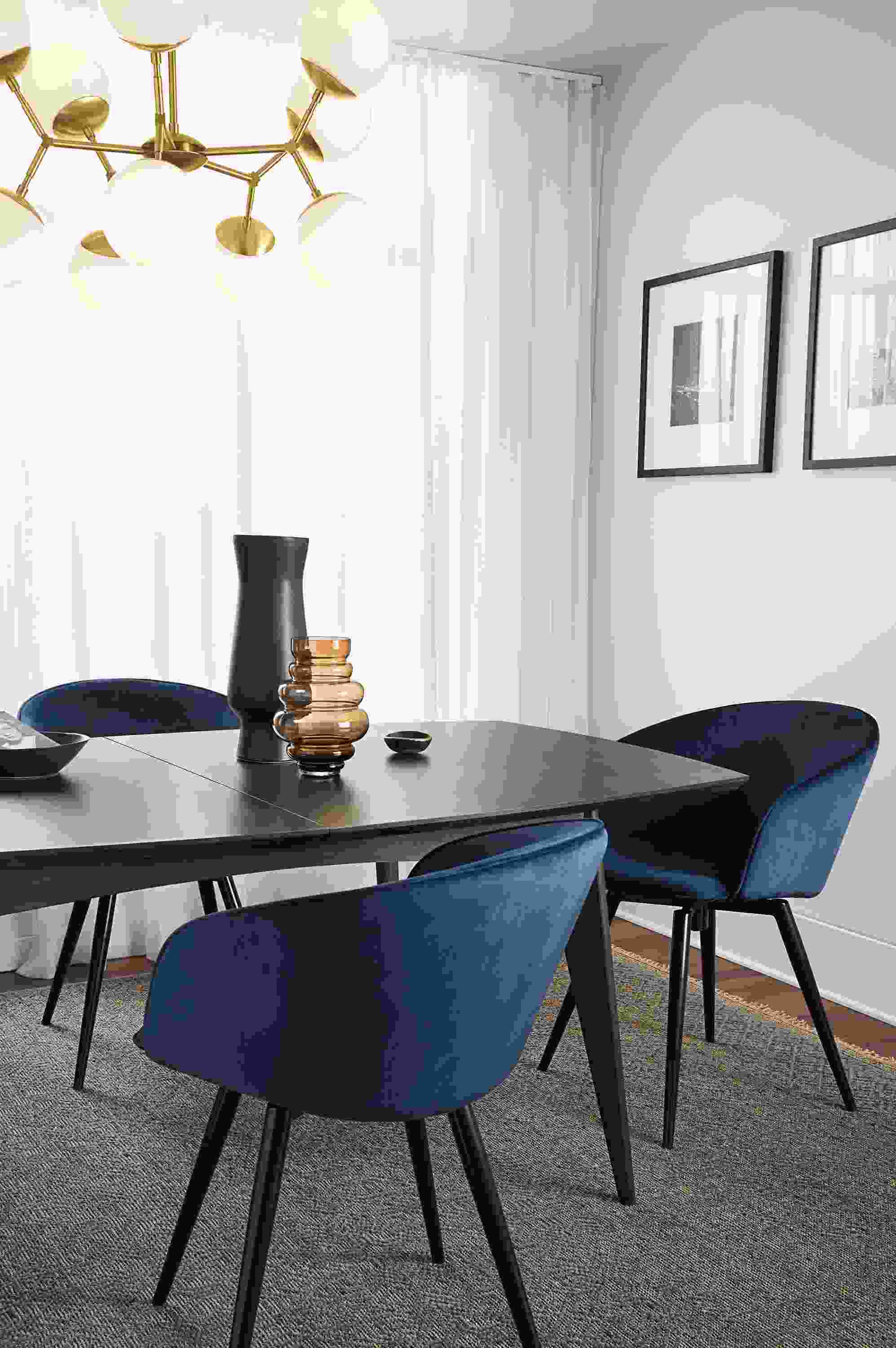 Dining room with Ventura extension table, Sylvan swivel side chairs, Anu rug, Cosma chandelier.