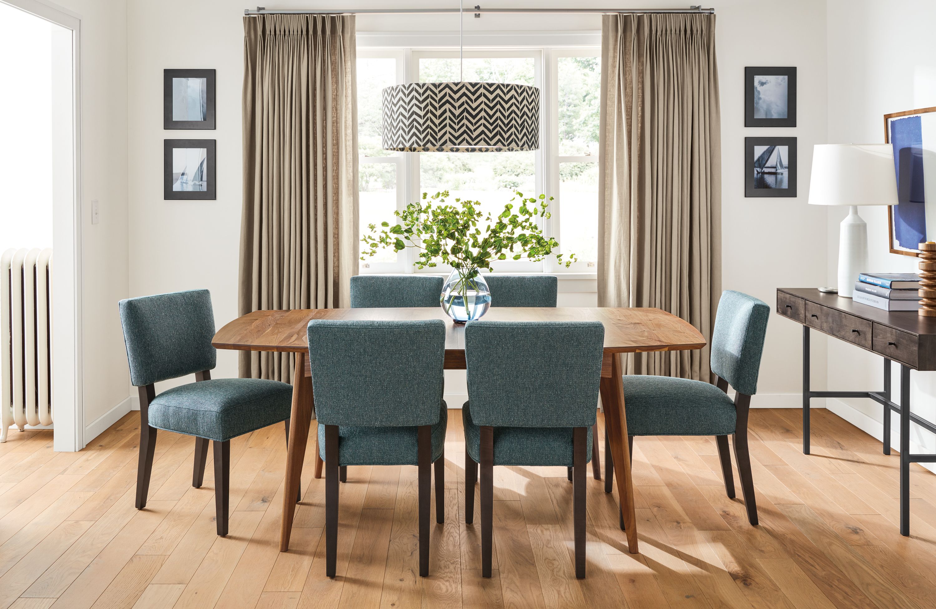 Detail of Ventura extension dining table in walnut.