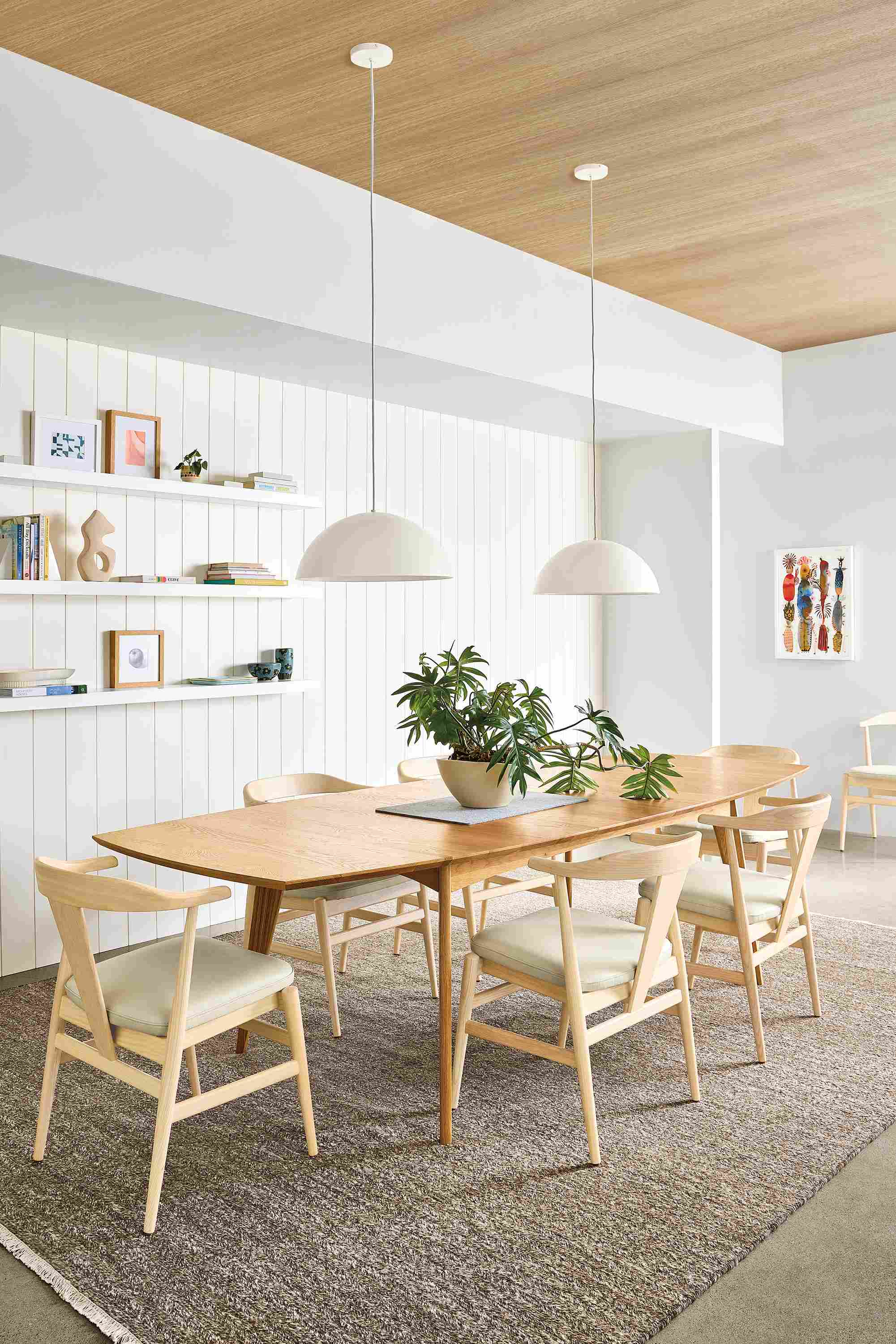 Dining room with Ventura extension table in white oak and Evan arm chairs in white oak with pesaro ivory seats.