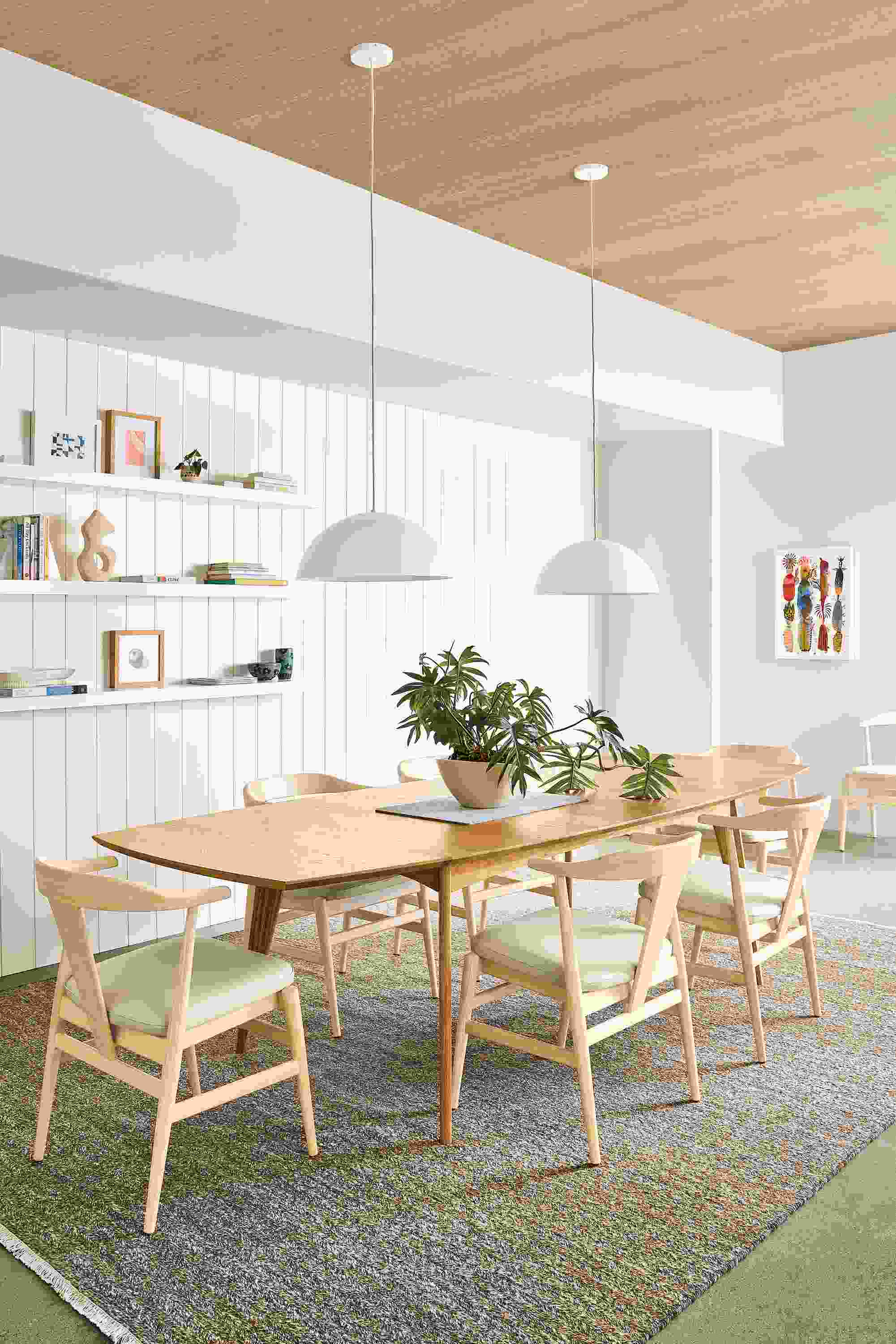 Dining room with Ventura extension table in white oak and Evan arm chairs in white oak with pesaro ivory seats.