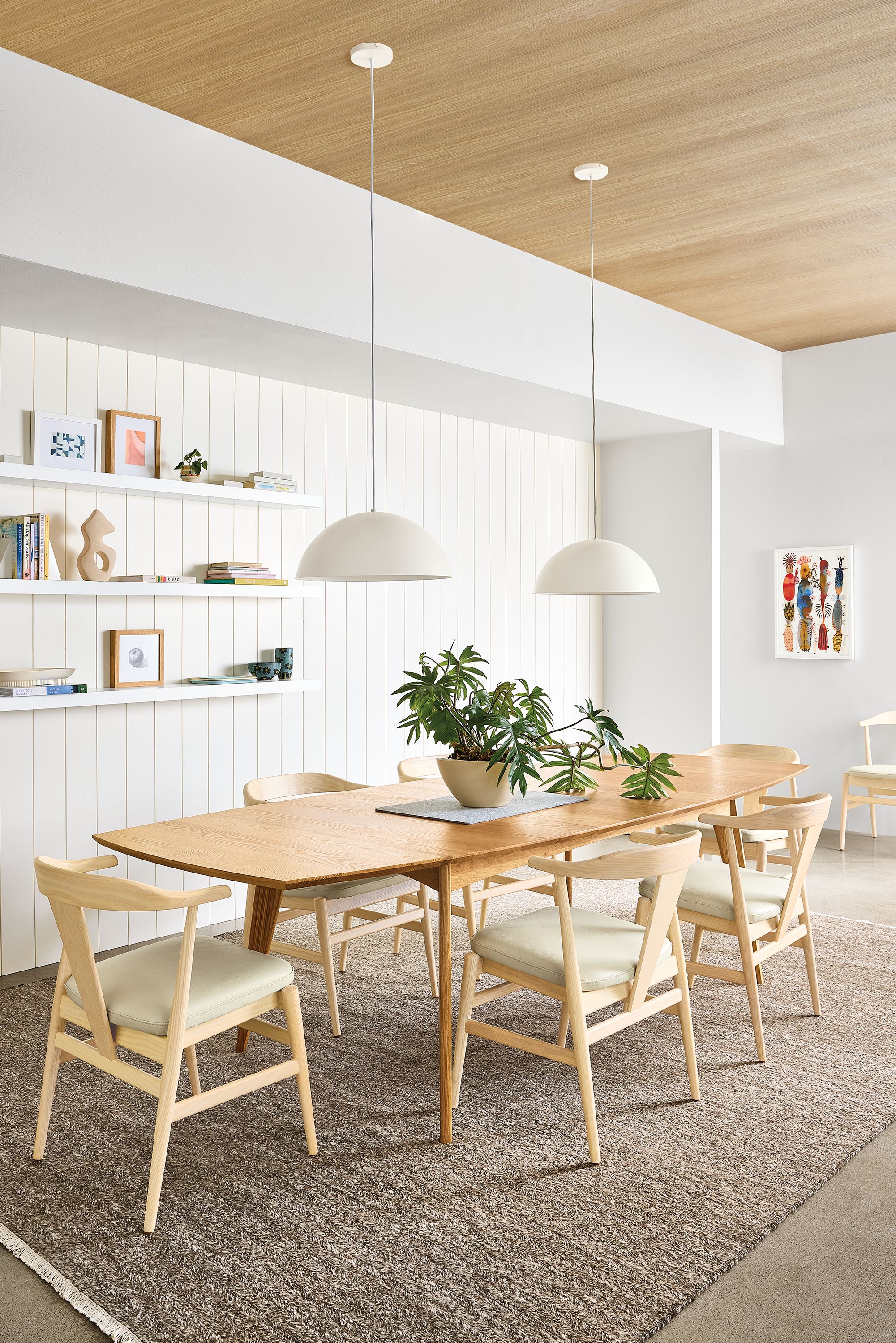Dining room with Ventura extension table in white oak and Evan arm chairs in white oak with pesaro ivory seats.
