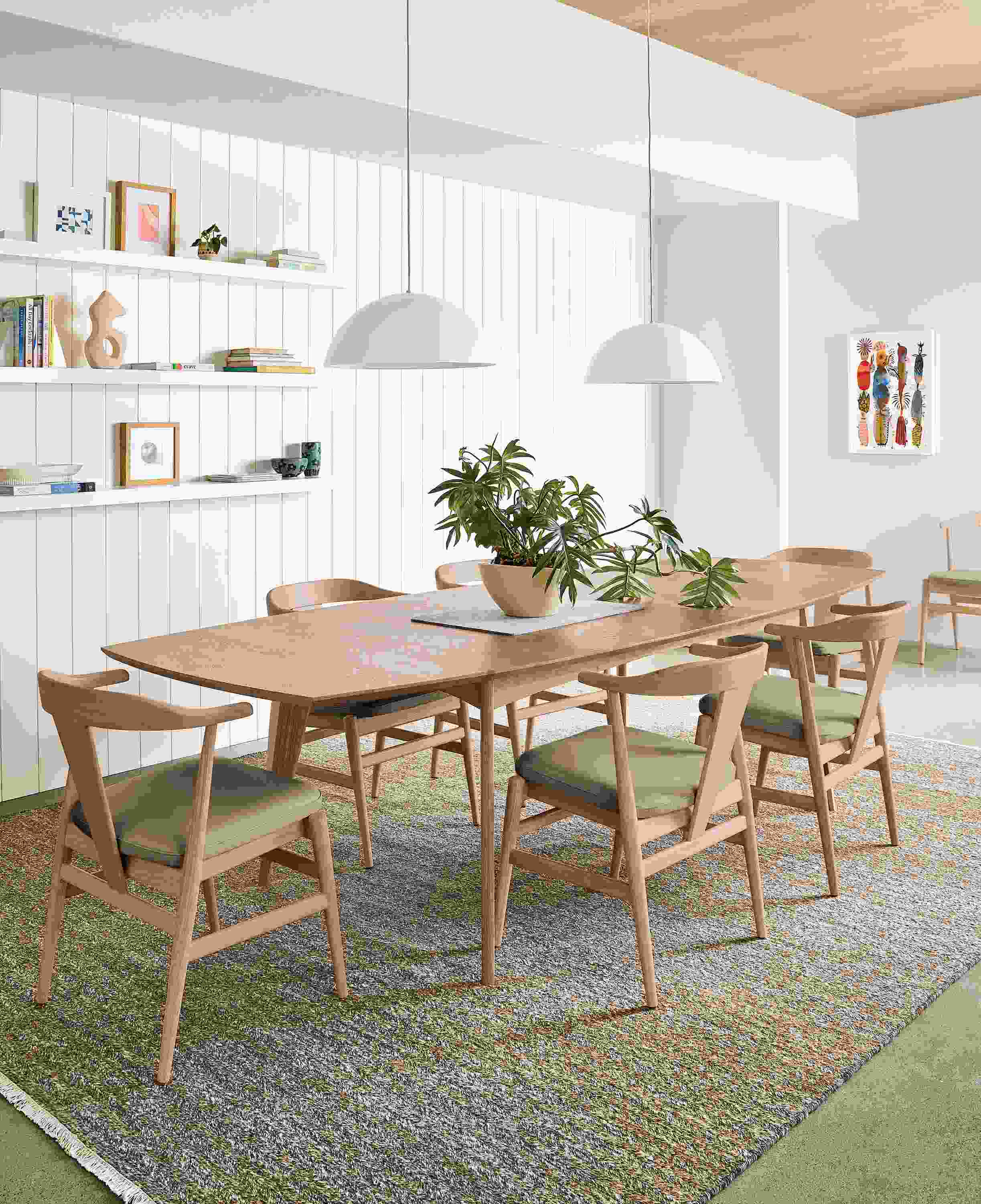 Dining room with Ventura extension table and Evan arm chairs in rye on red oak.