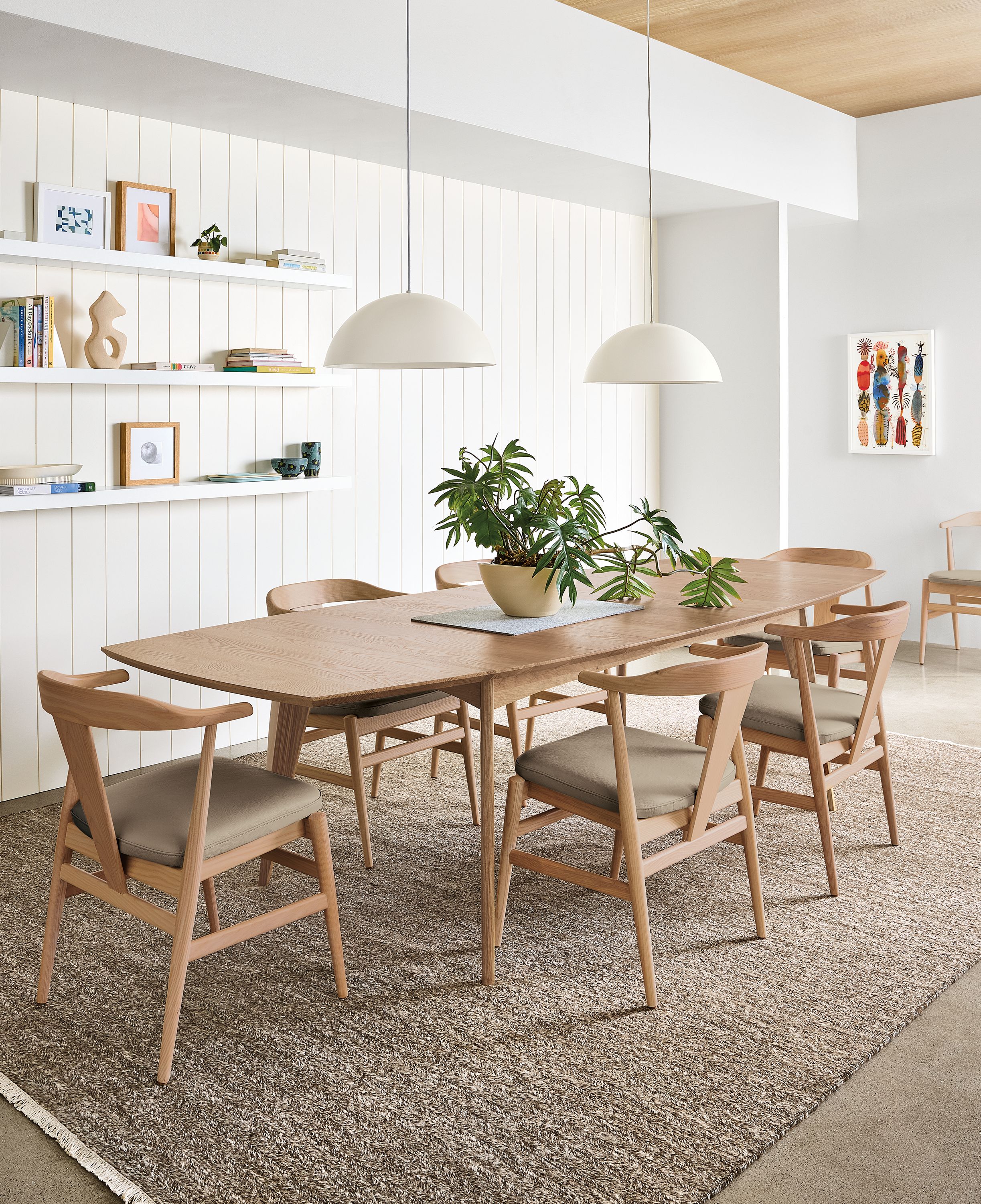 Dining room with Ventura extension table and Evan arm chairs in rye on red oak.