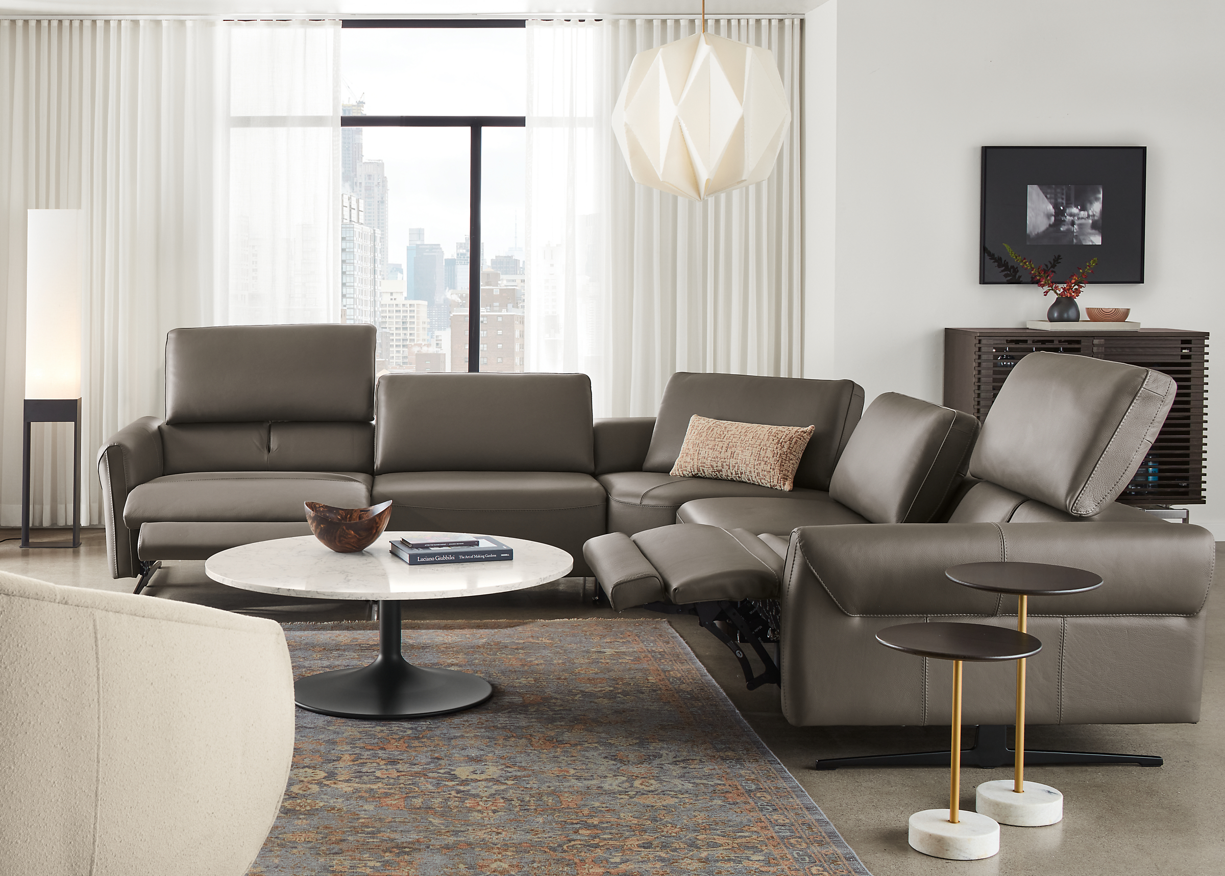 living room with vesna L-shaped sectional in nikola leather with two headrests extended and two footrests extended