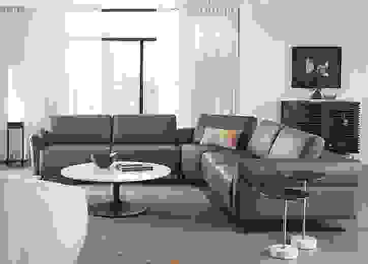 living room with vesna L-shaped sectional in nikola leather with all headrests and footrests collapsed