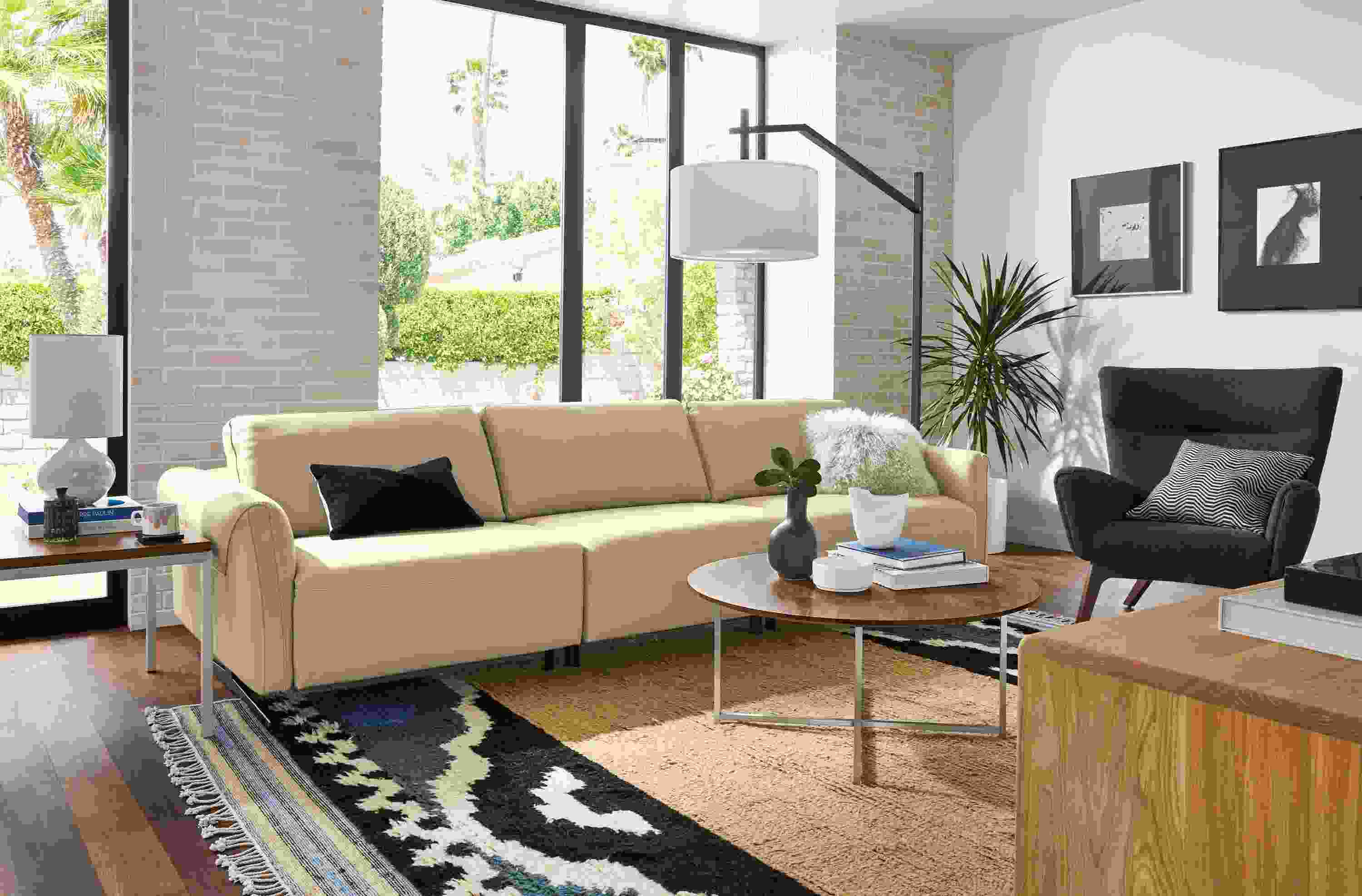 Living room with Vesna sofa in Nikola Stone leather with all headrests collapsed and all footrests collapsed.