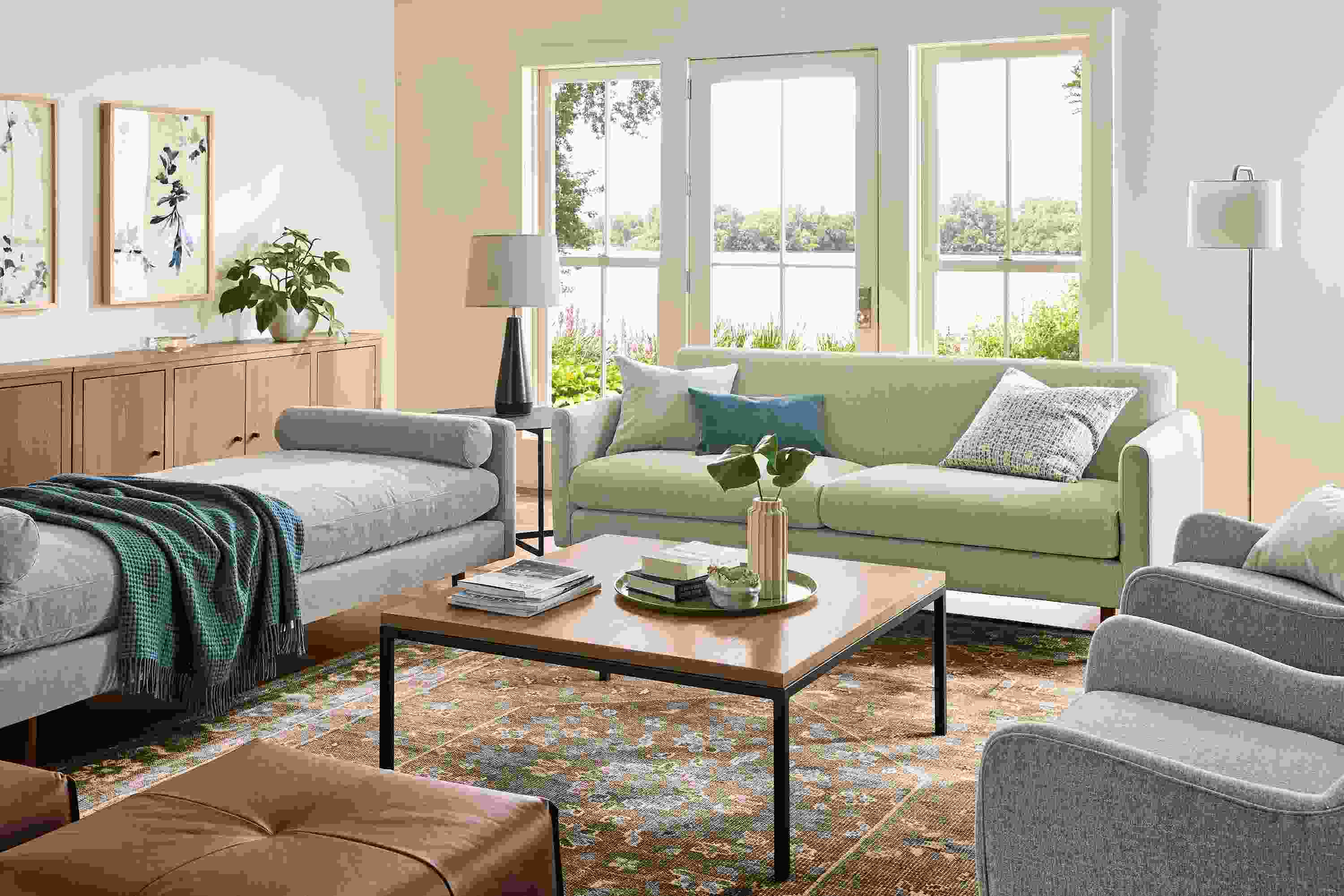 Living room with vienna sofa in sumner linen, jasper daybed in mori cement and veda 9 by 12 rug in moss.
