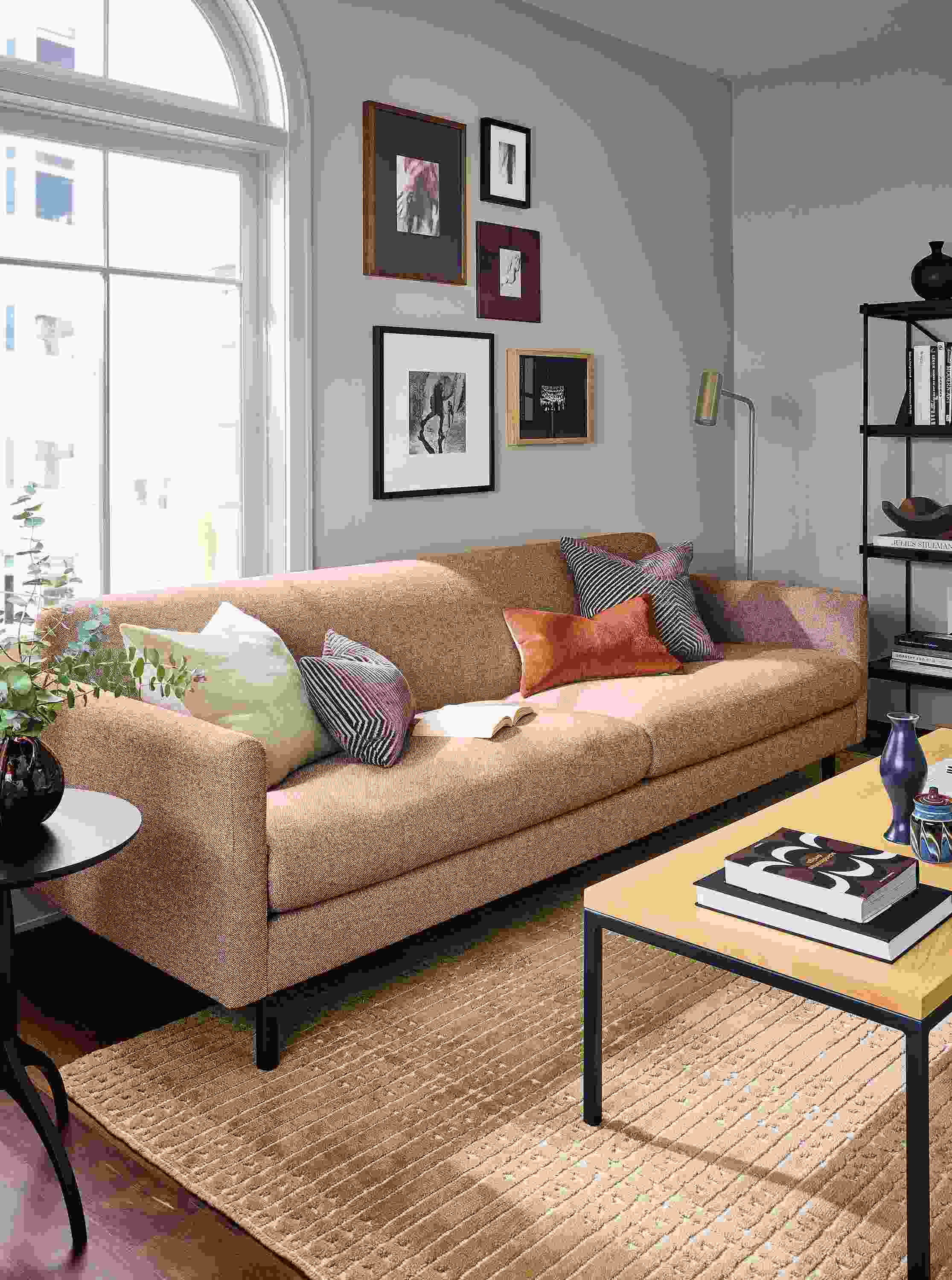 Living room with Vienna sofa in Tatum Clay and Bria 8 by 10 rug in mustard.