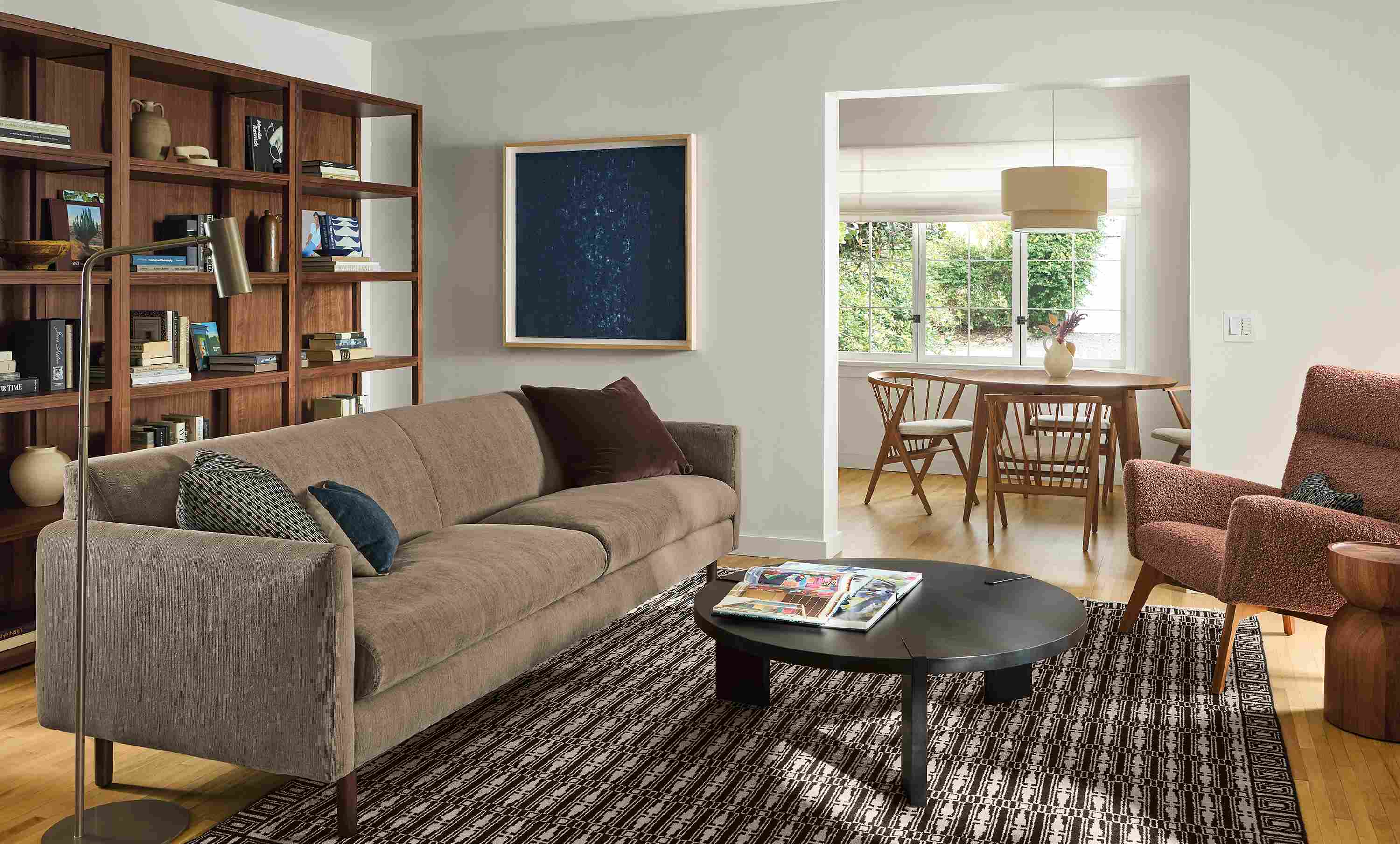 Living room with Vienna 100-wide sofa in Nigel Otter, Hanover 42-diameter coffee table in charcoal and Tulum rug in ebony.